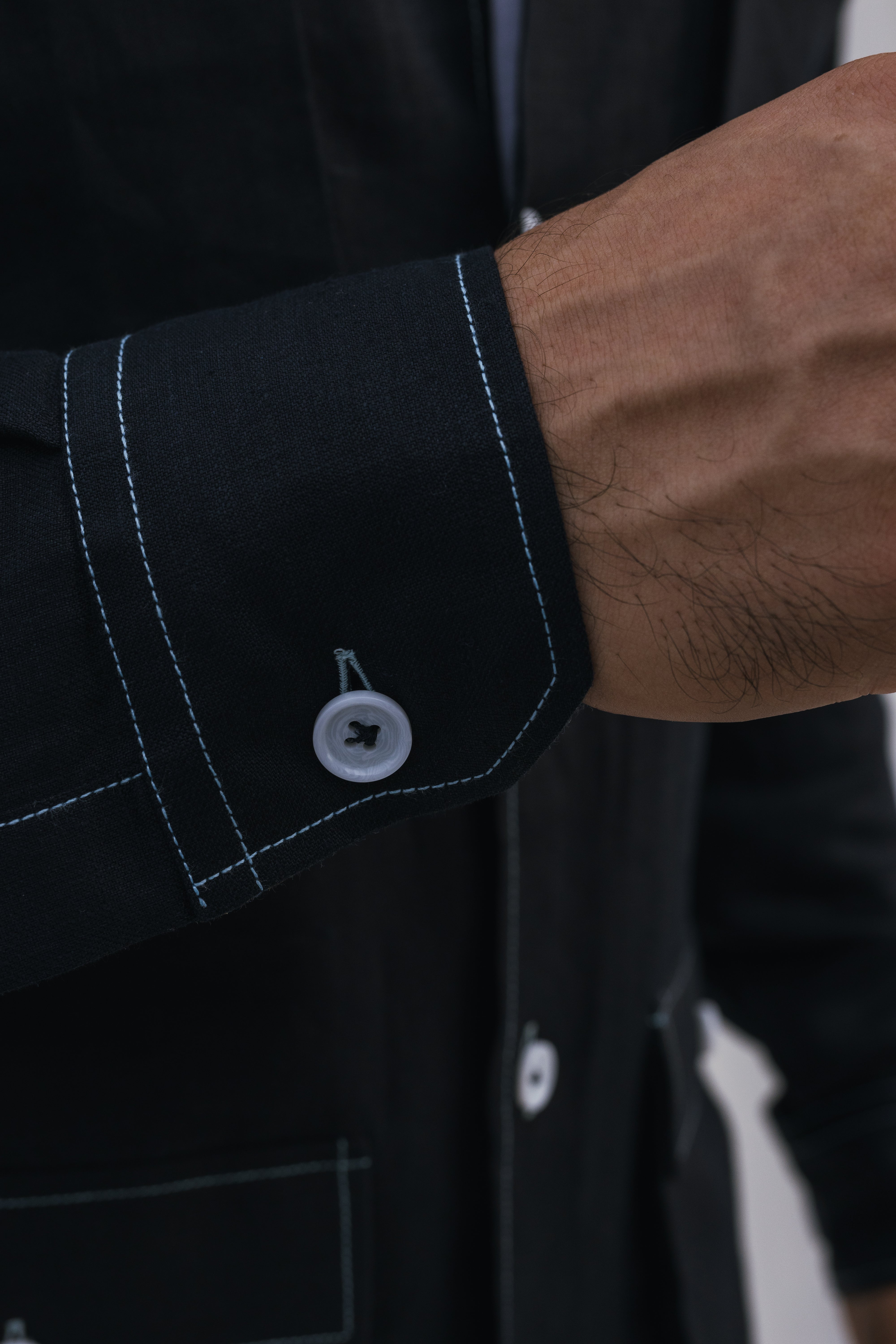 Black safari shirt with white contrast stitch and floral detail