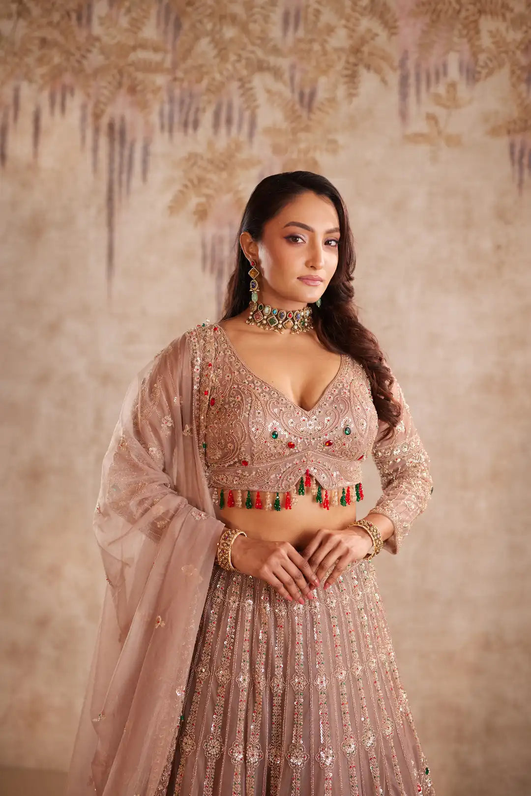Mauve net lehenga with multi color beadwork