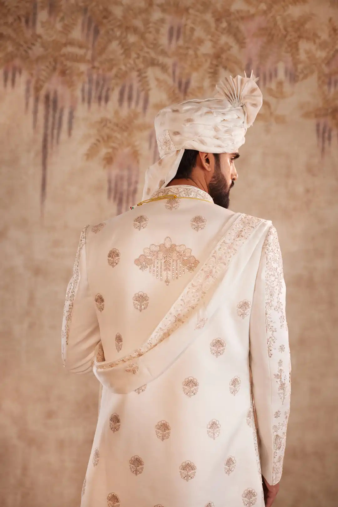 Off white silk Sherwani with pastel floral embroidery