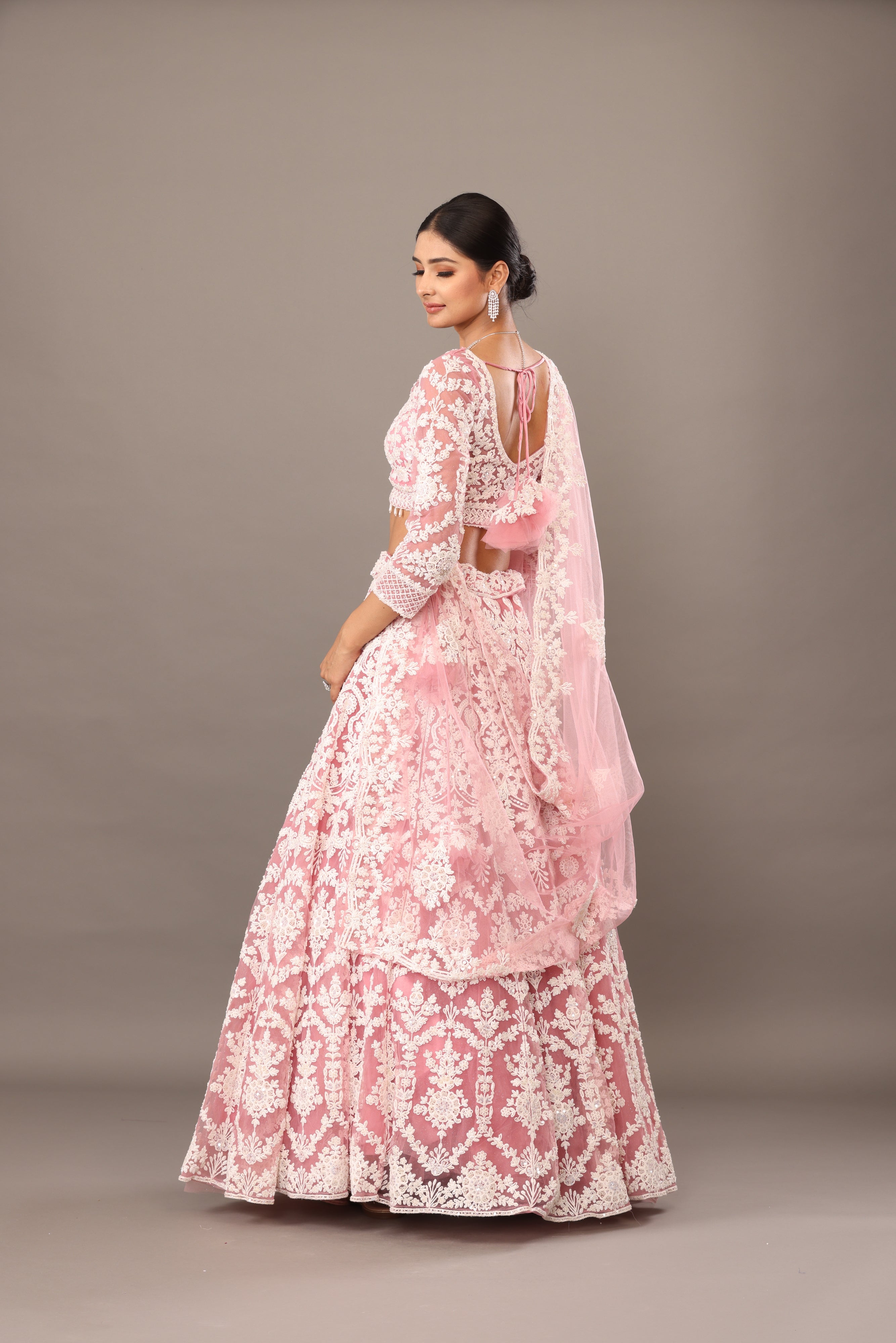 Pink net lehenga with pearl embellishments