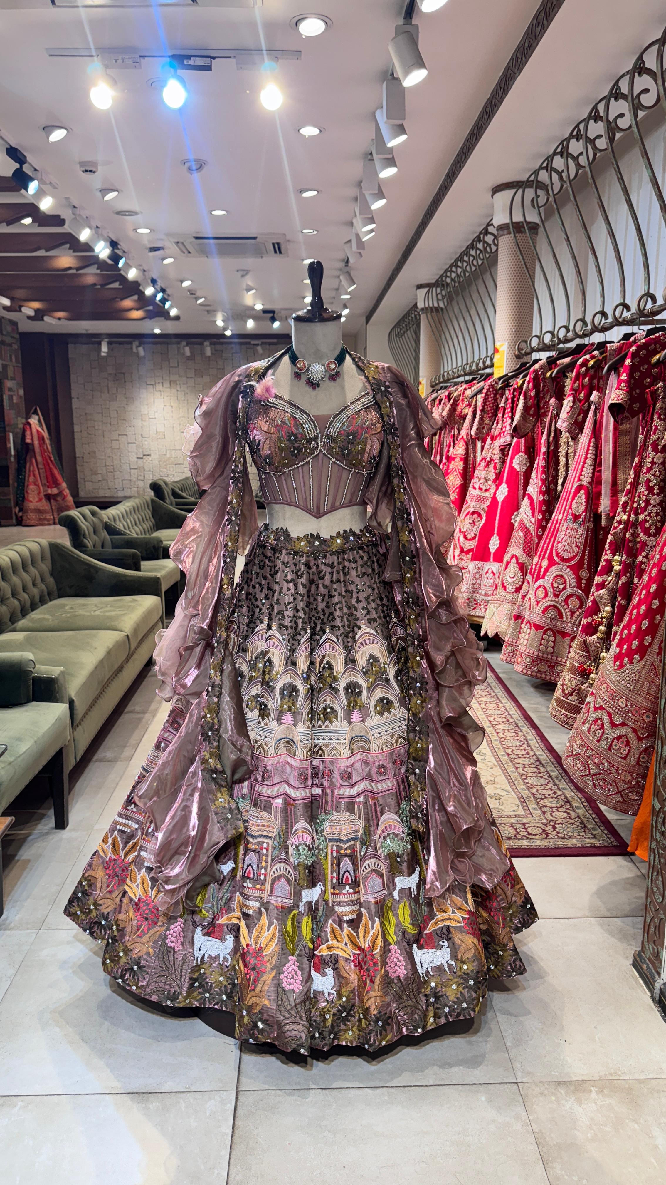 Colorful embroidered traditional outfit on a mannequin in a store setting.