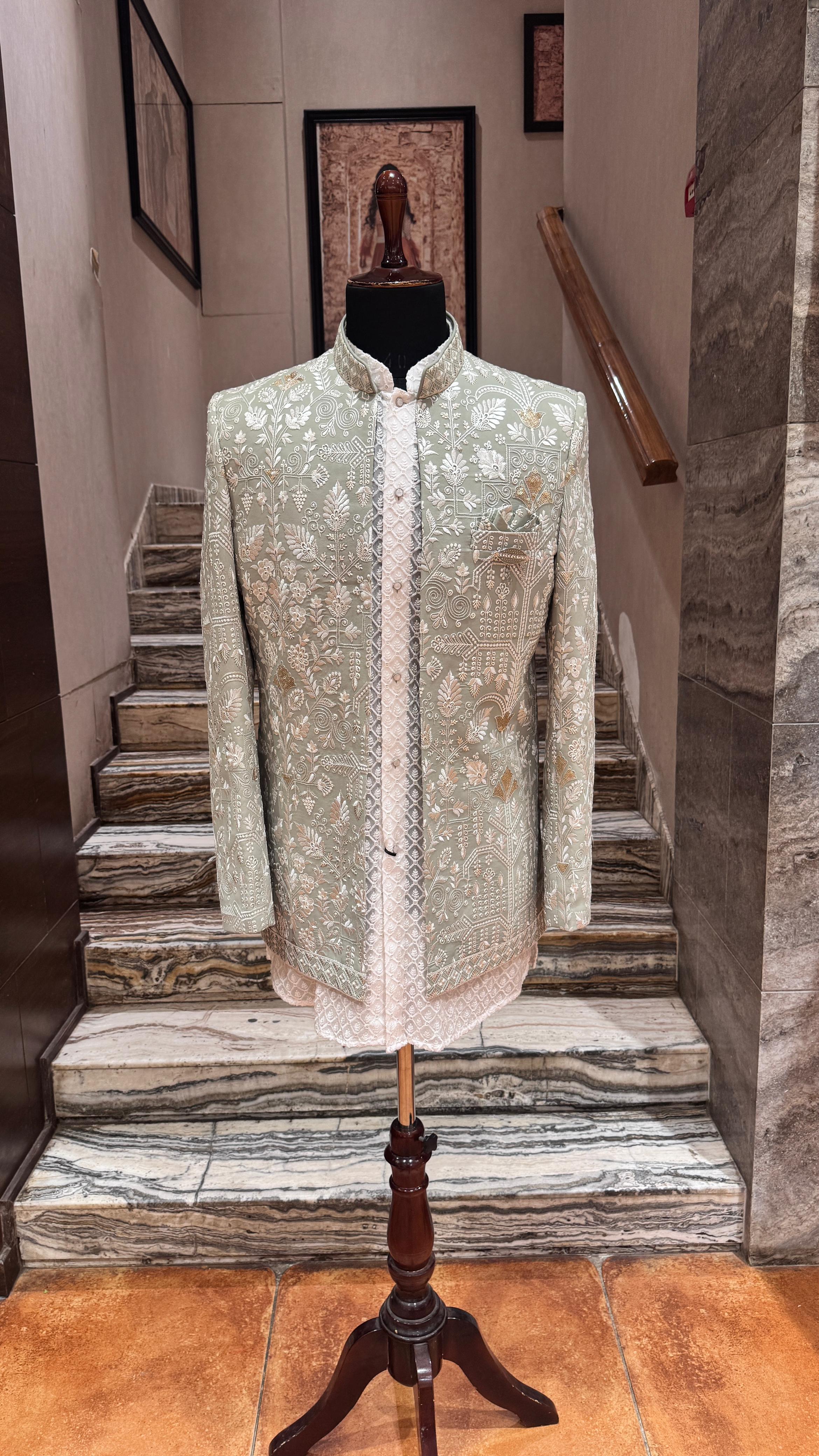 Embroidered jacket on a mannequin stand in front of a staircase