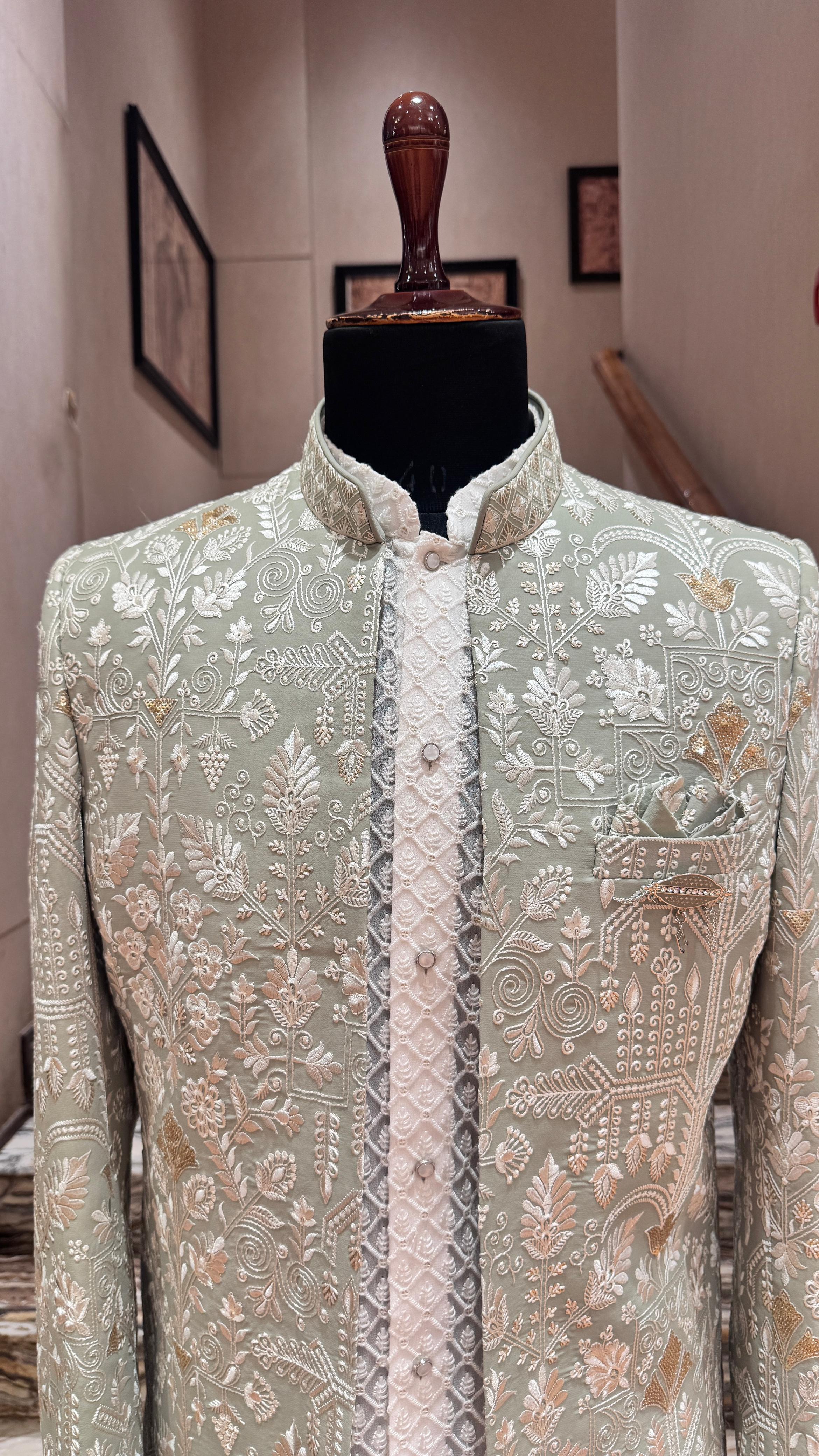 Traditional embroidered shirt on a mannequin with a neutral background