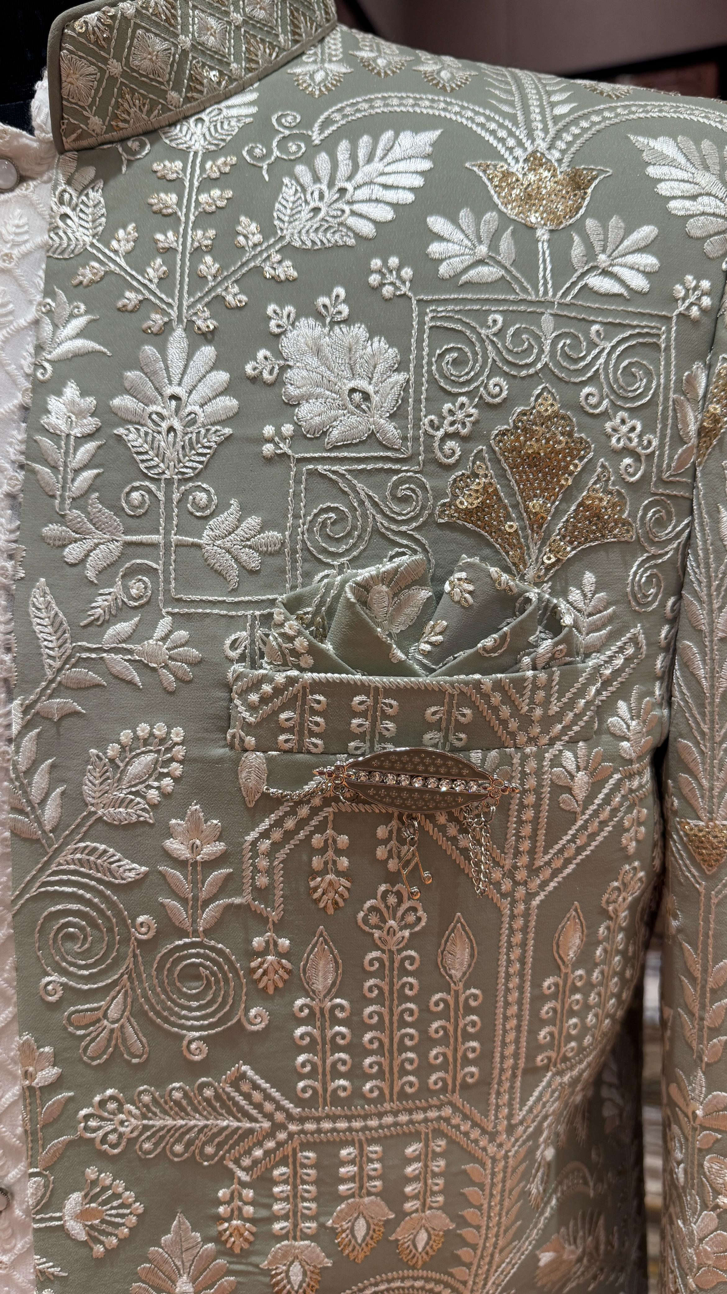 Close-up of a garment with intricate floral and geometric embroidery.