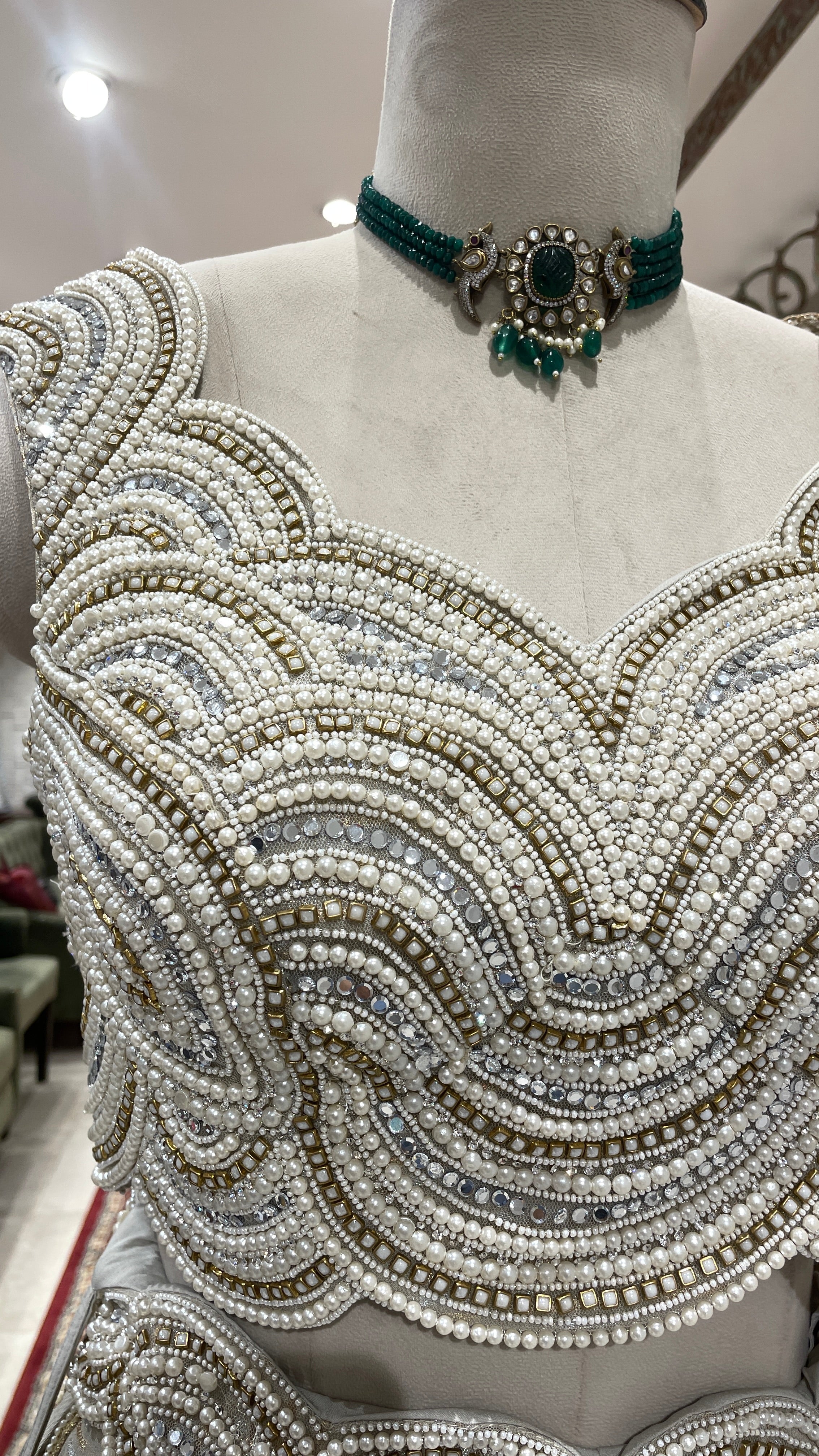 Ivory tissue lehenga with heavy embellished blouse