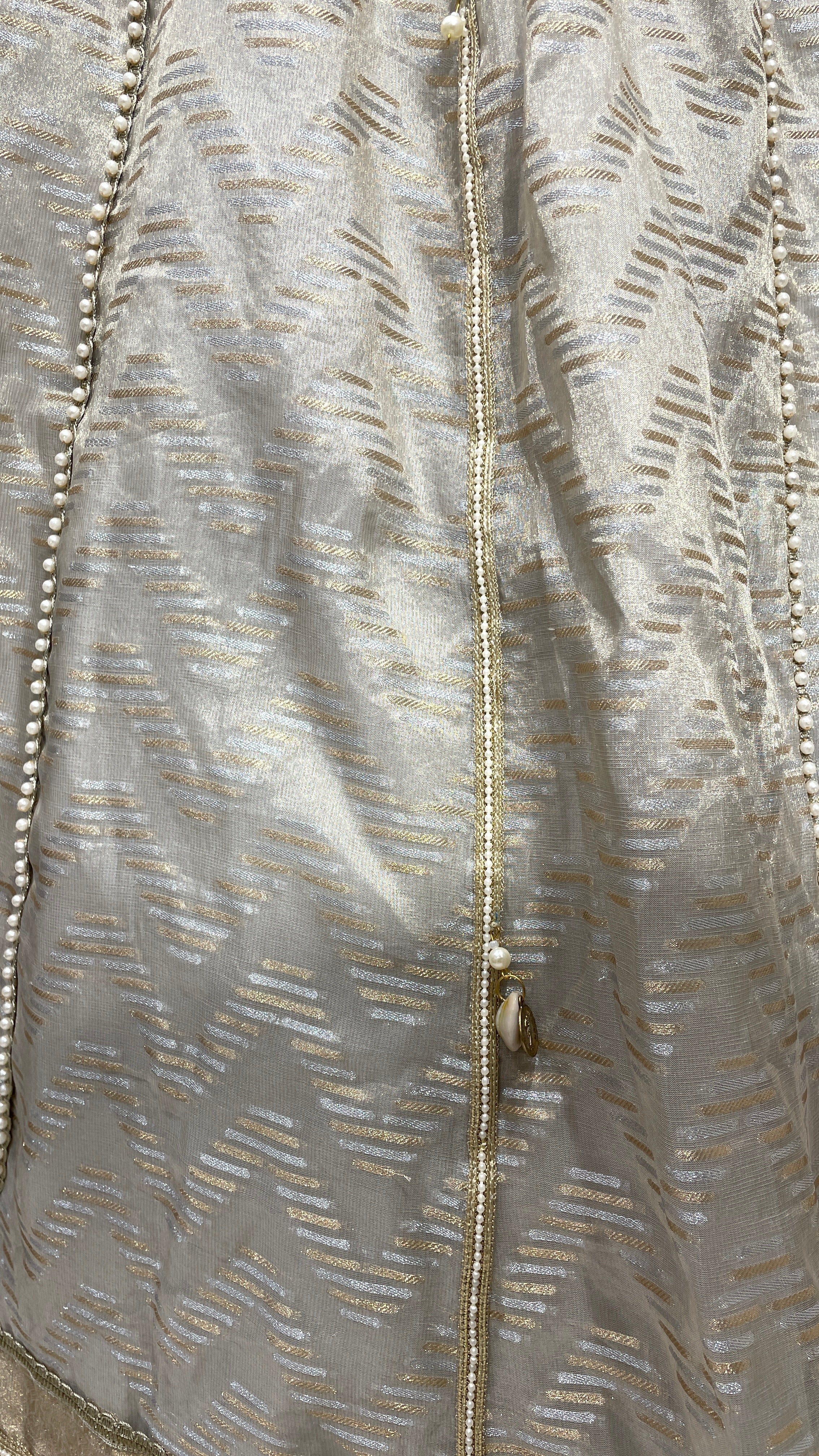 Ivory tissue lehenga with heavy embellished blouse