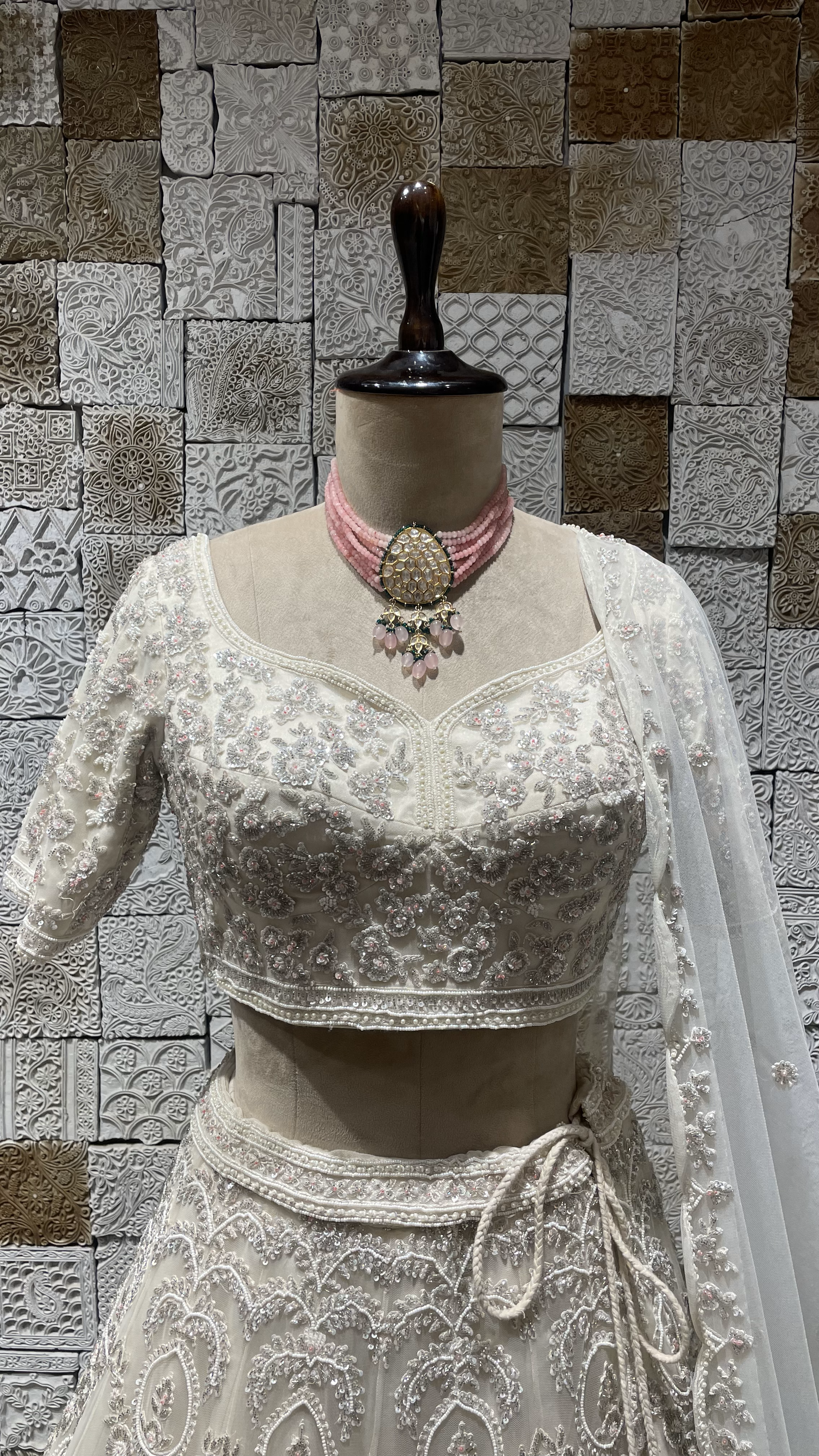 Ivory handwork embellished lehenga with cutdana and heavy latkans