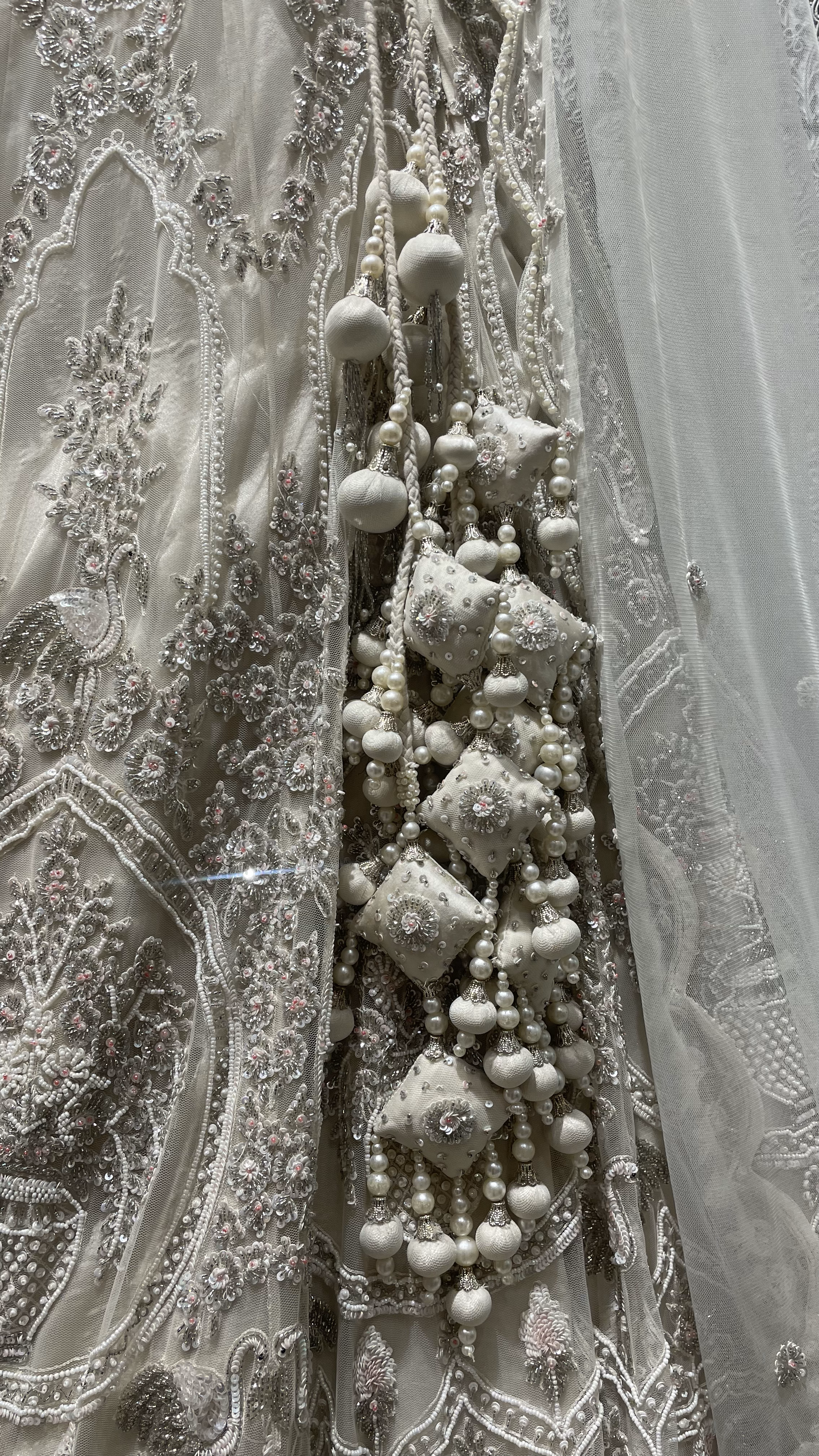 Ivory handwork embellished lehenga with cutdana and heavy latkans