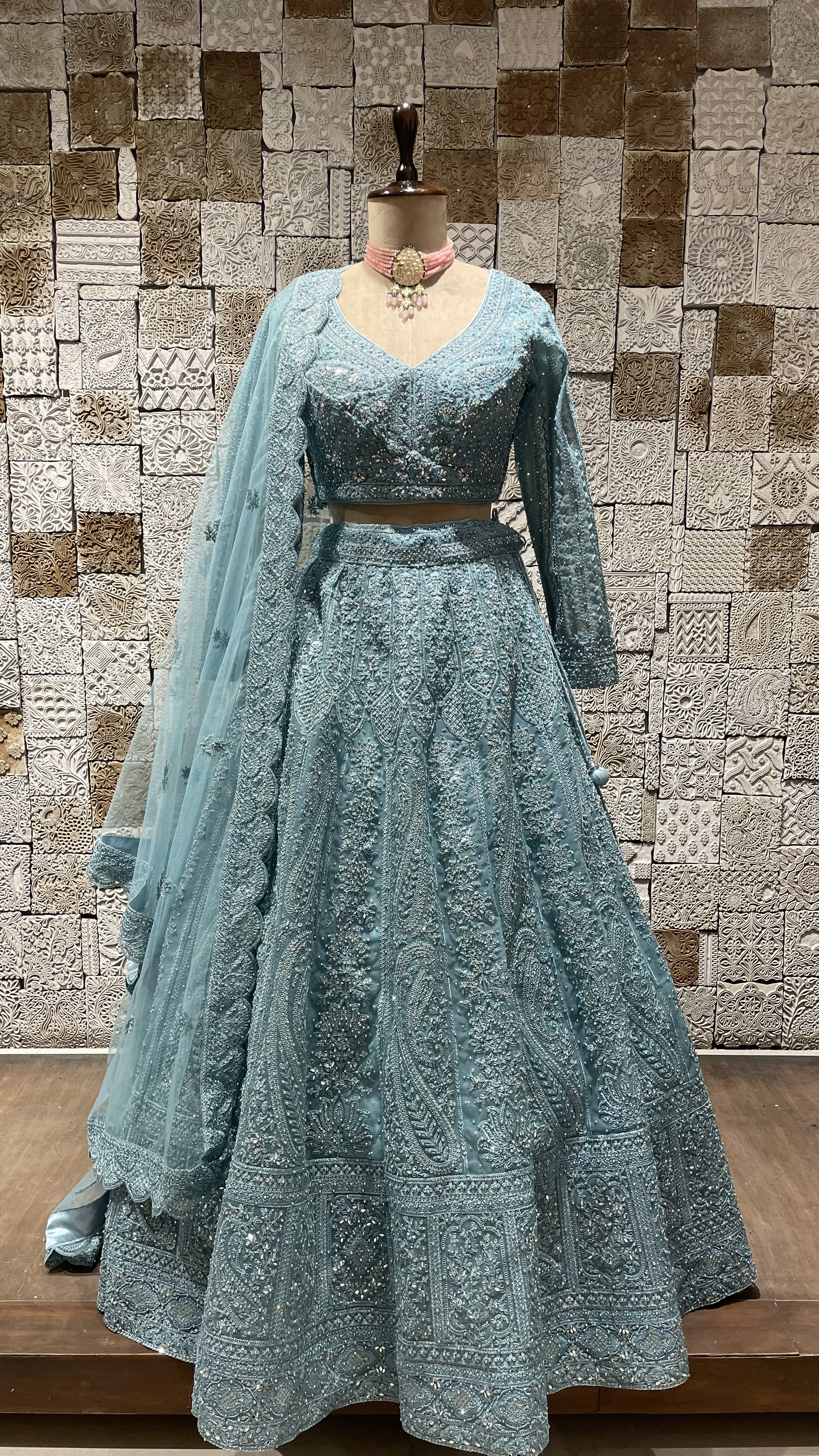 Blue mirrorwork net lehenga with mirror and pearl embellishments
