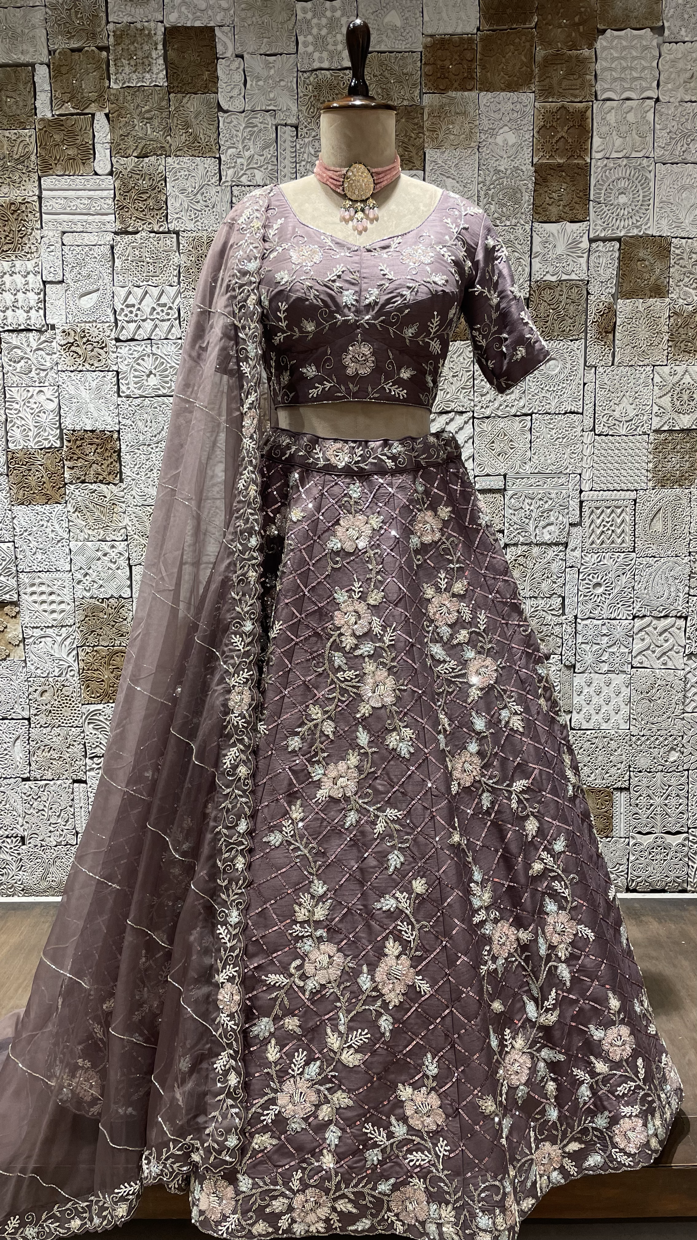 Purple Silk Lehenga with Sequins and cutdana embellishments and floral motifs