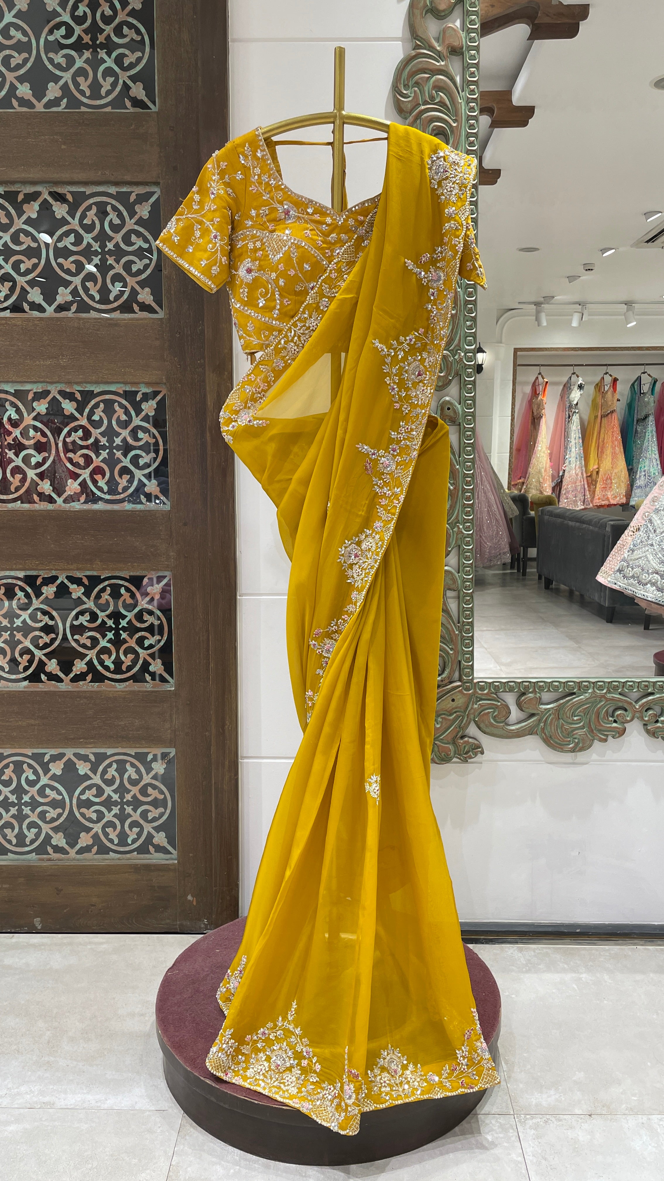Mustard organza saree with floral motifs