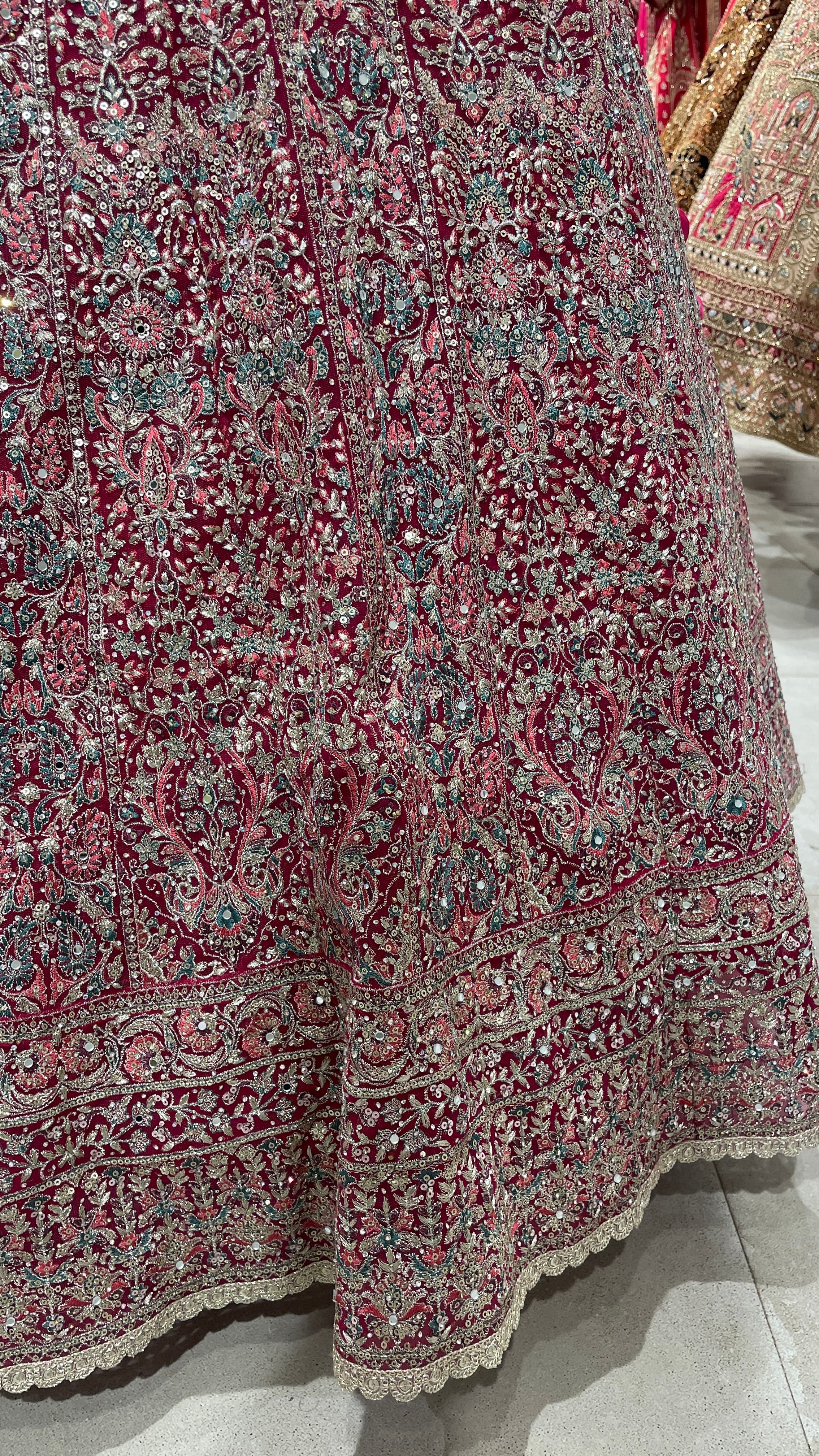 Pink net lehenga with floral motifs