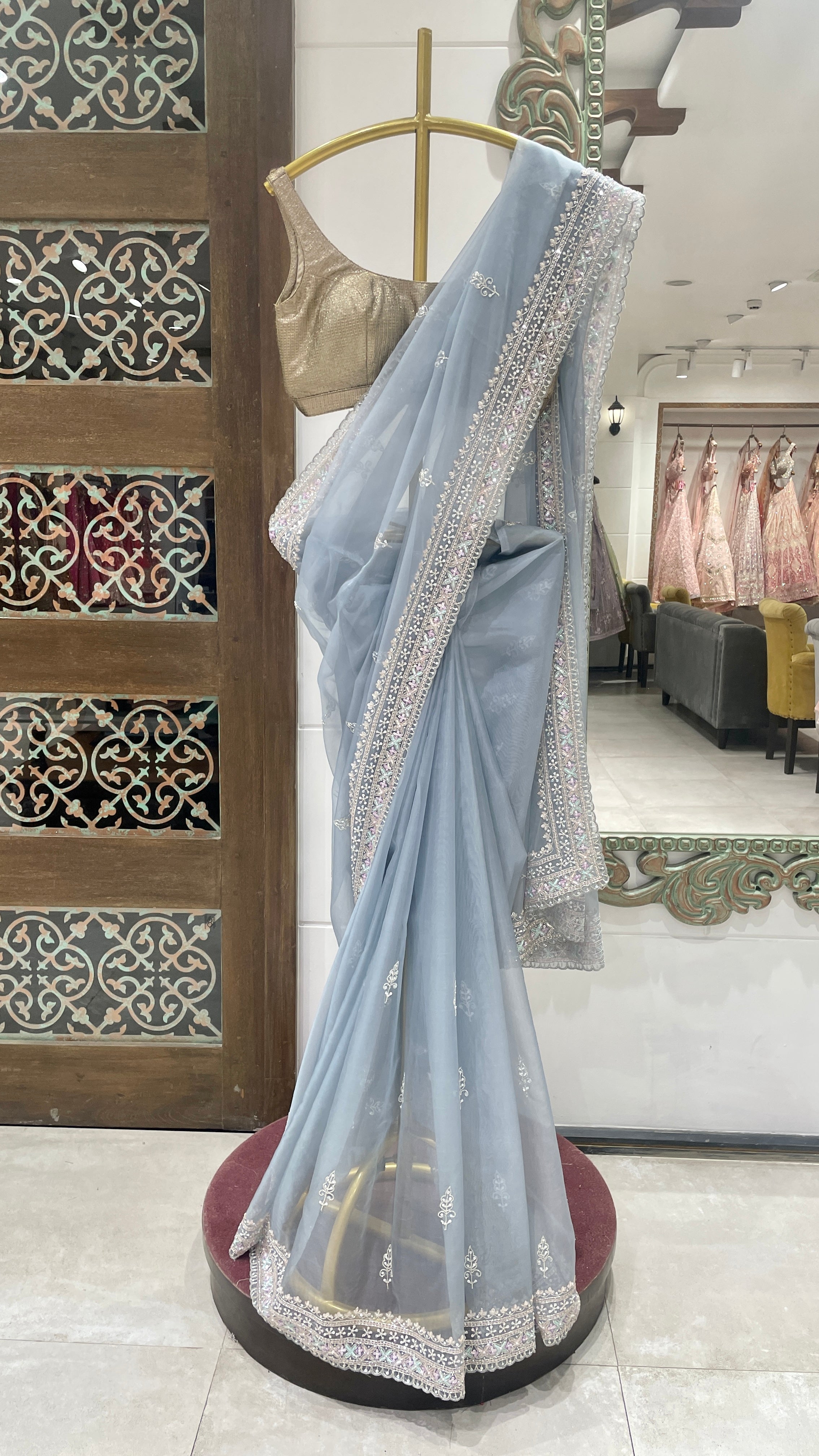 Blue organza saree with sequins and cutdana