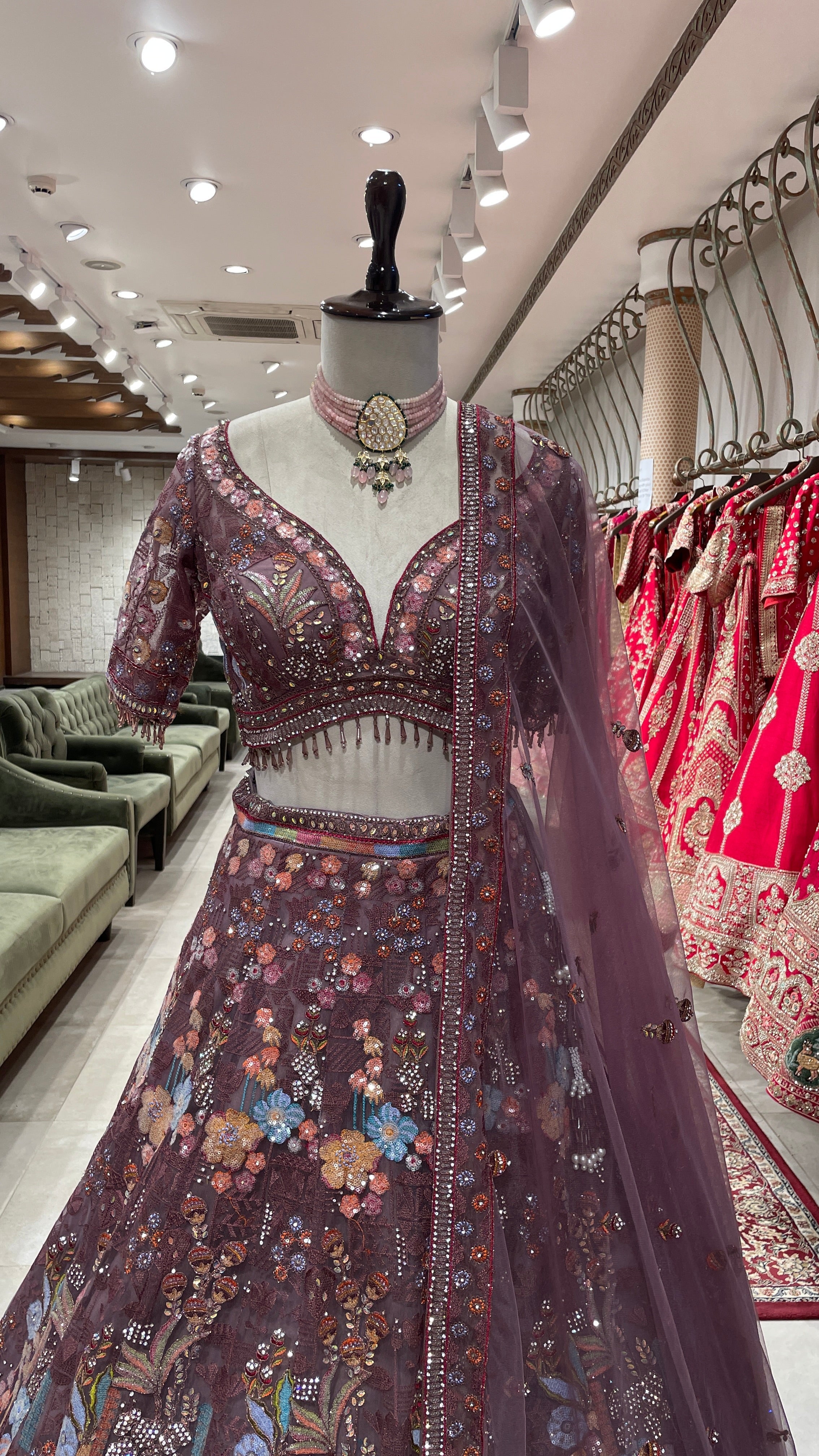 Rust colour Lehenga with multicolour thread and sequins work