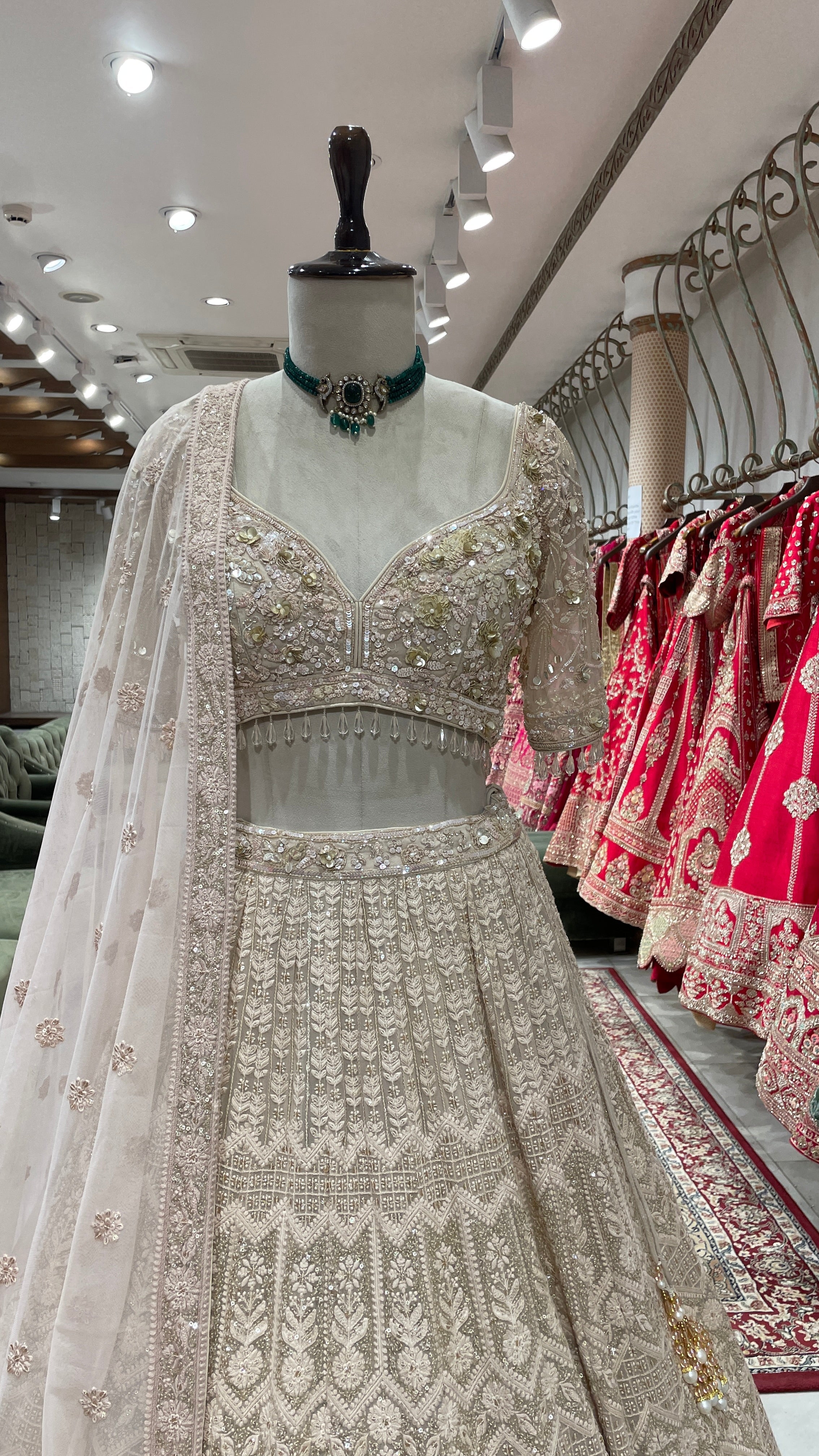 Beige colour lehenga with white and gold thread and sequins work