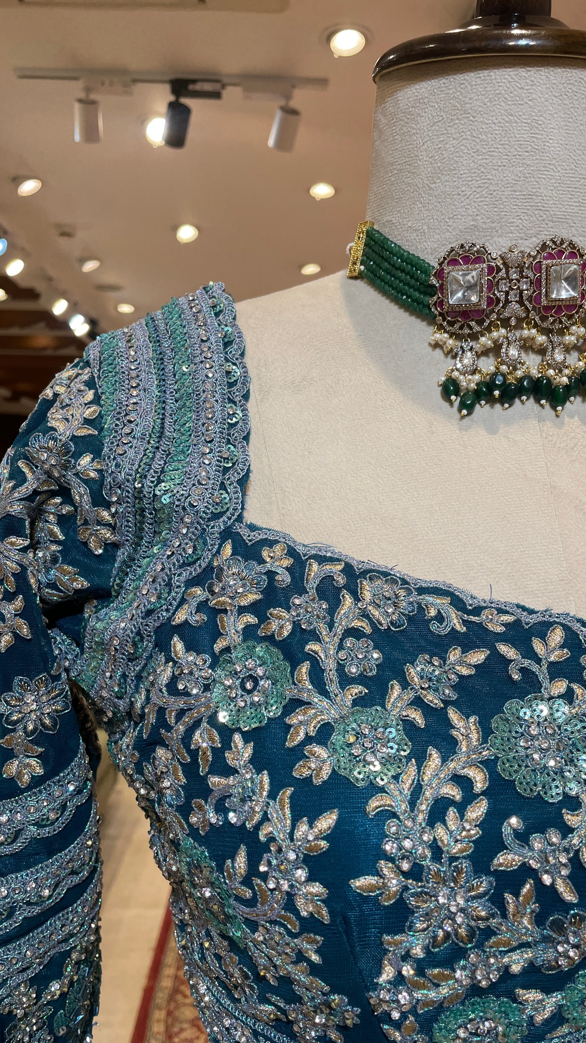 Turquoise blue lehenga with floral motifs