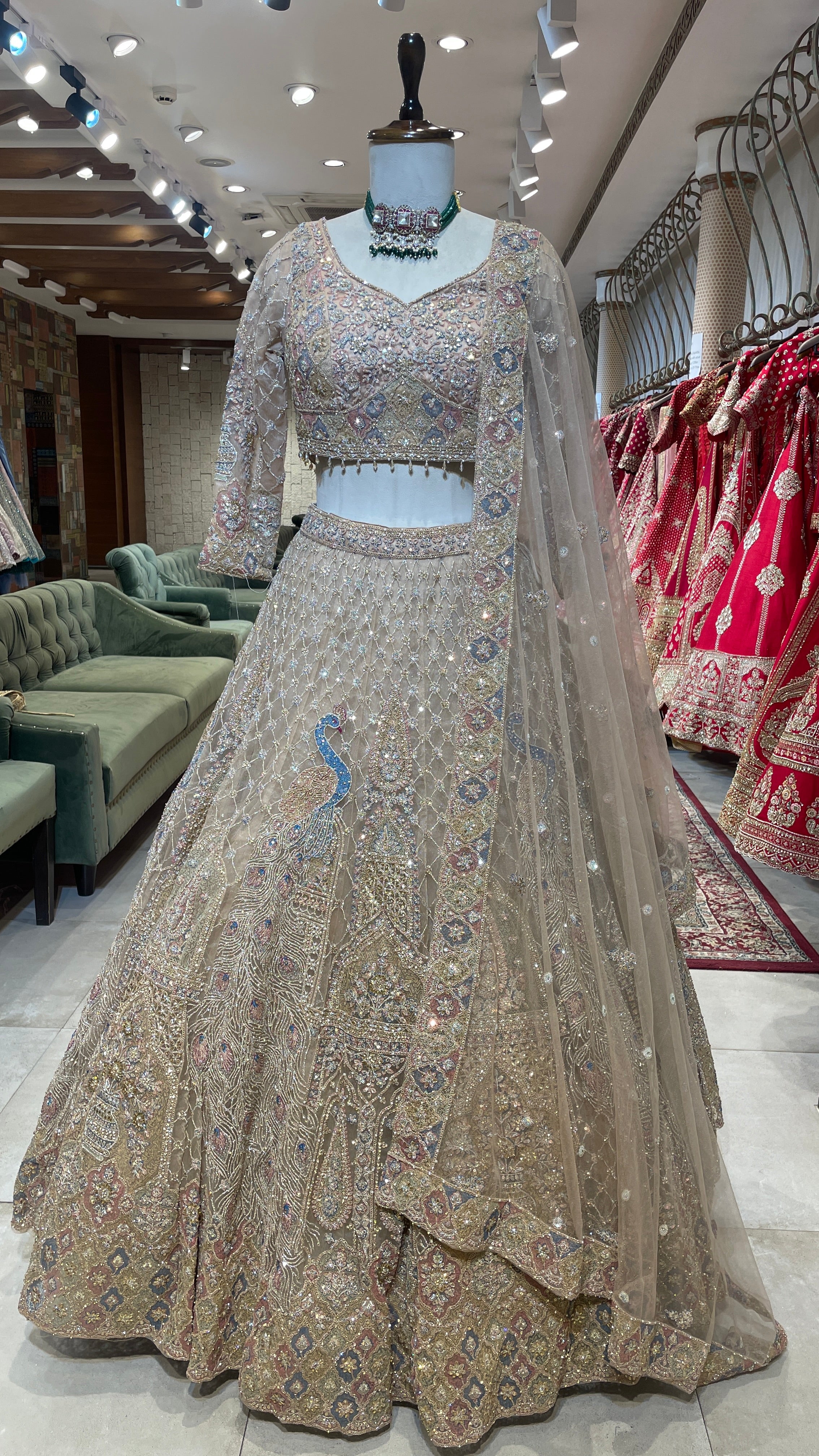 Gold multicolour net lehenga with peacock motifs