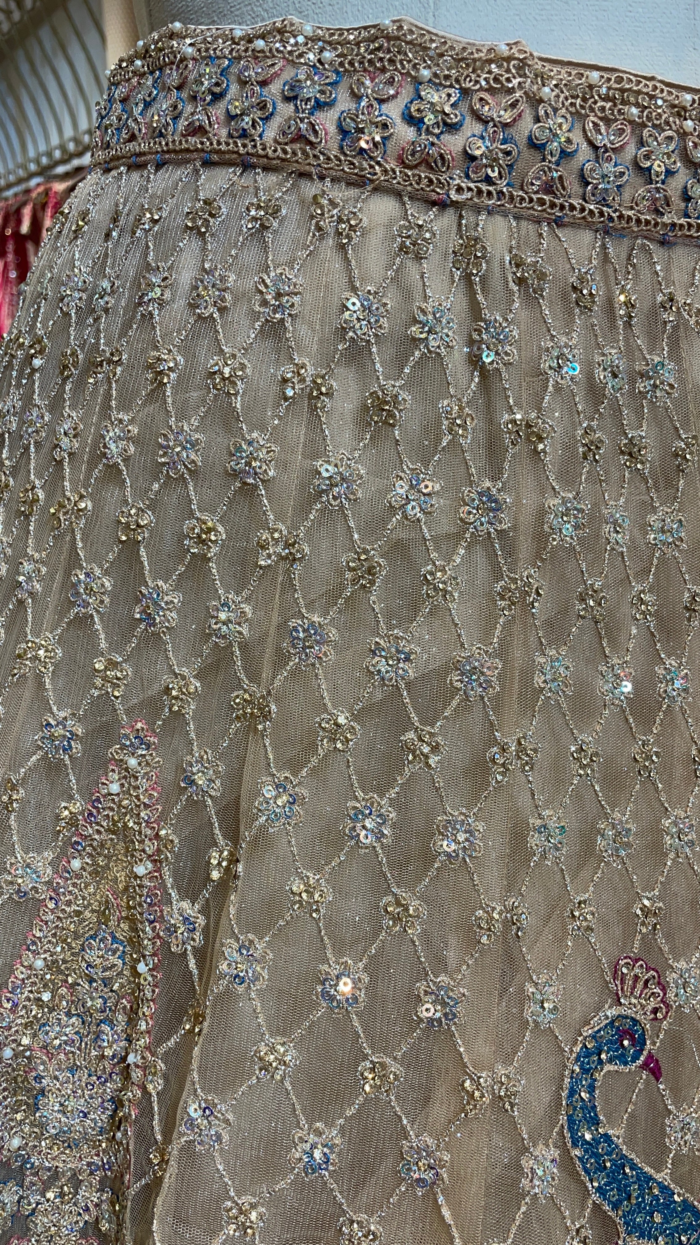 Gold multicolour net lehenga with peacock motifs