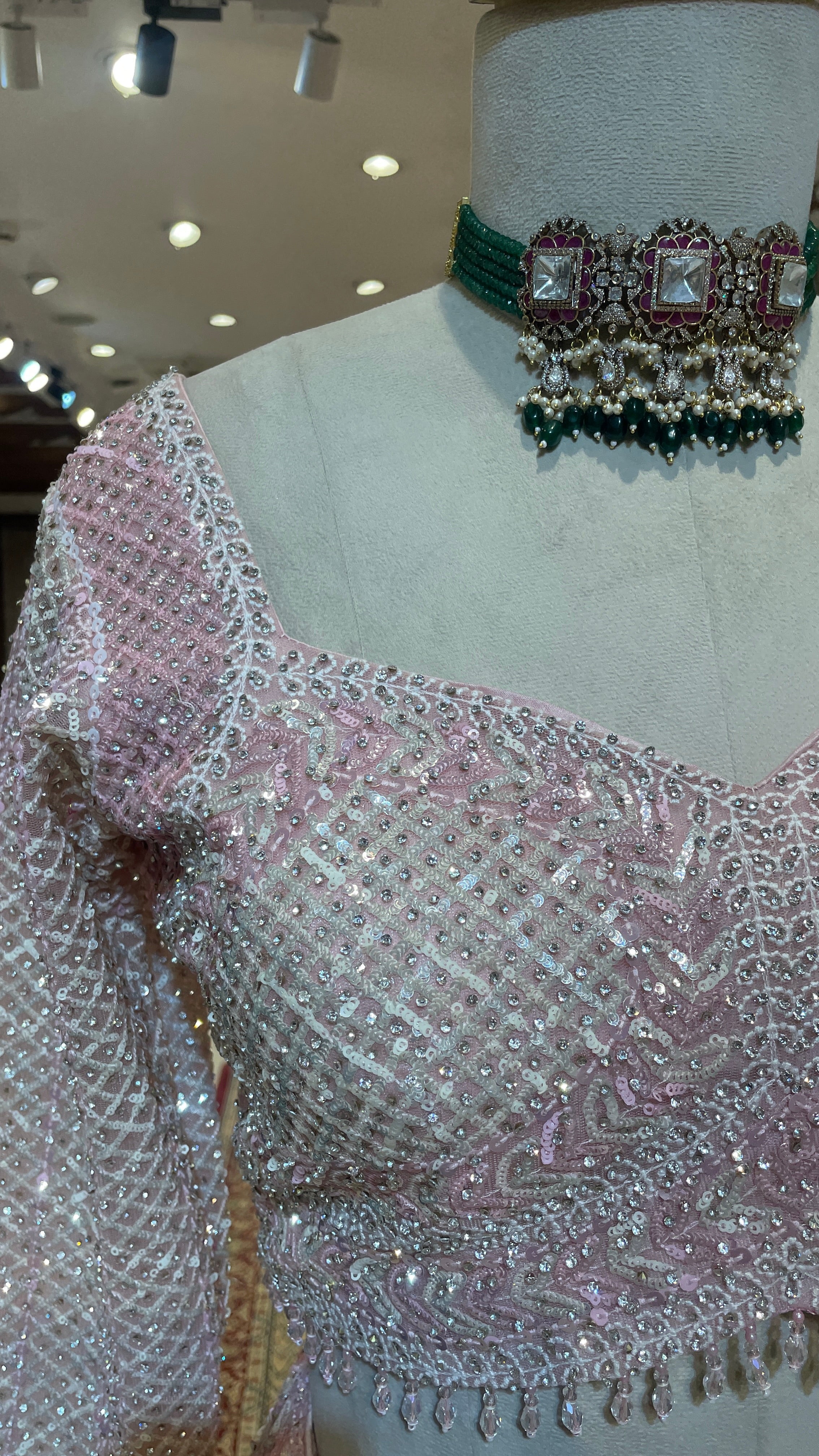Pastel pink net lehenga with sequins and scallop dupatta