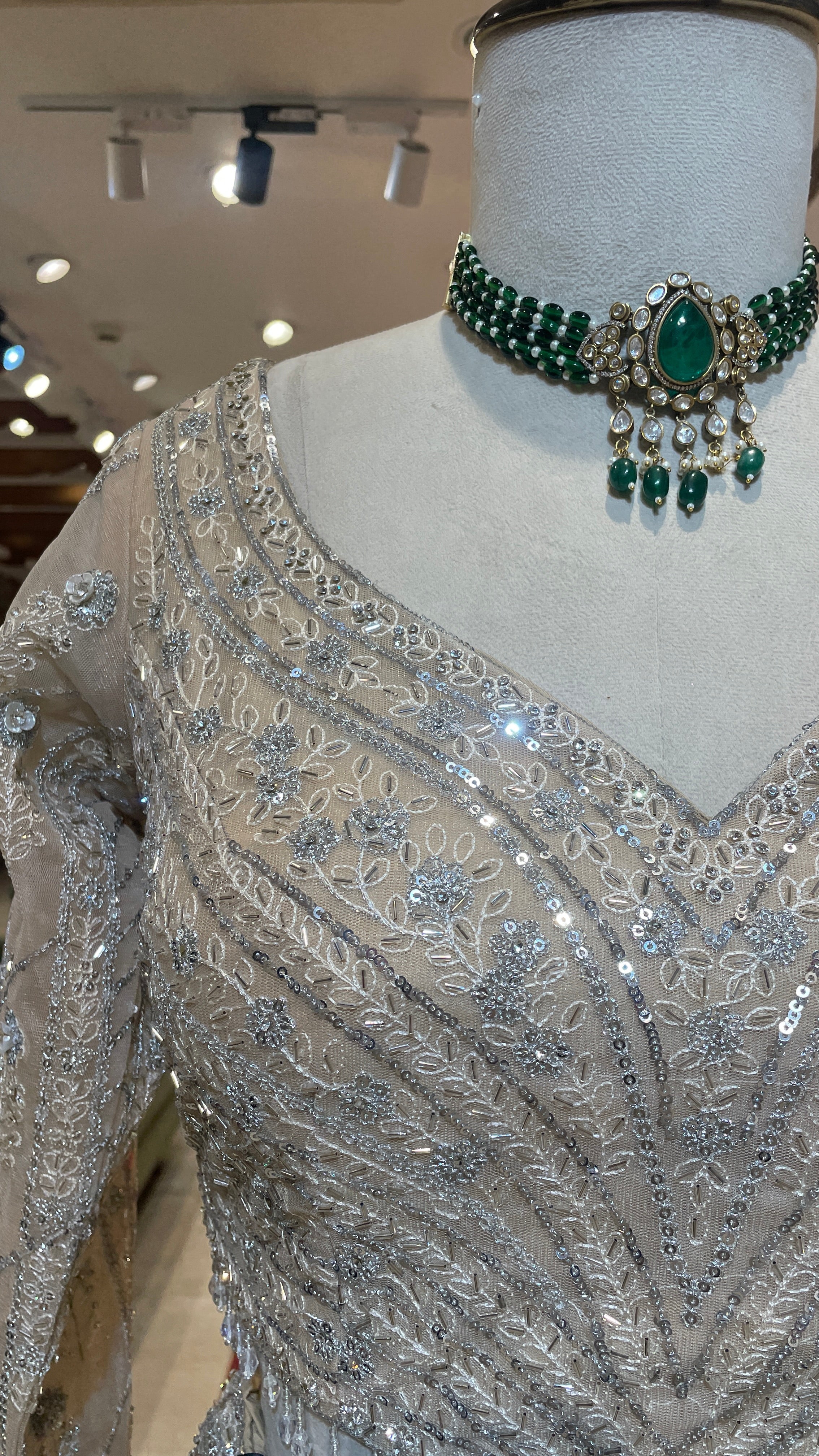 Cream net lehenga with sequins embellishments