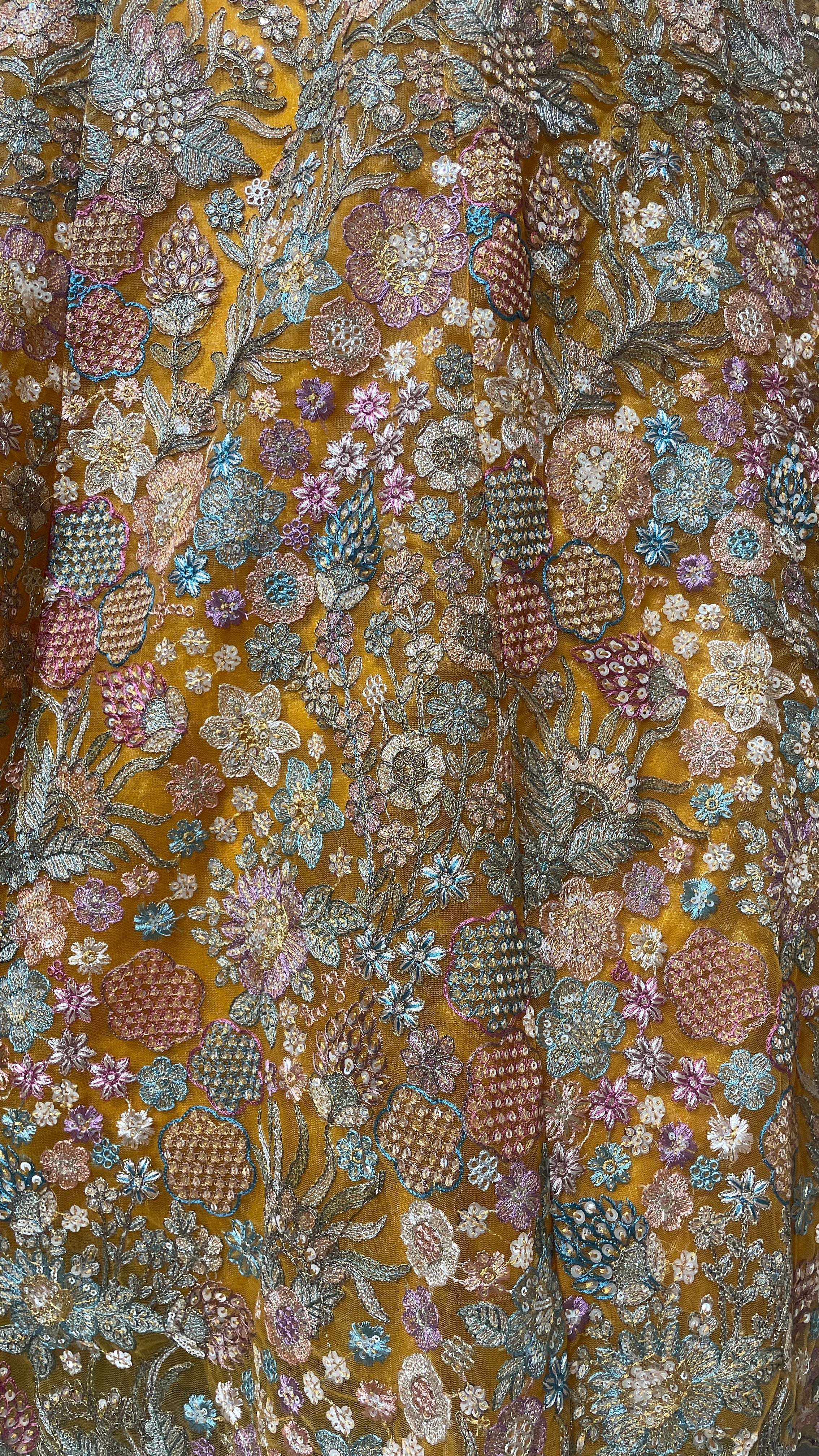 Mustard organza lehenga with floral motifs