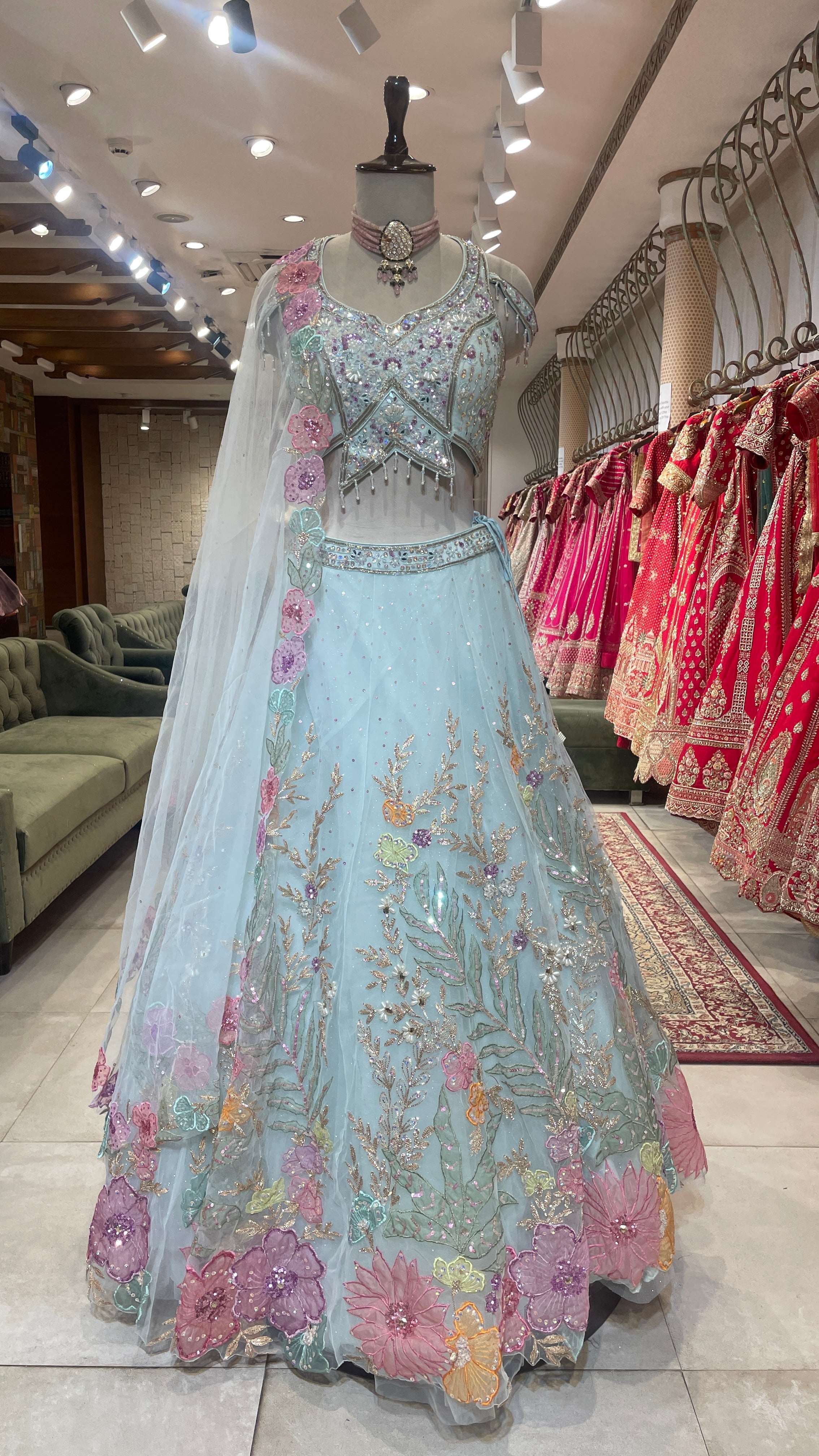Pastel blue net lehenga with floral motifs