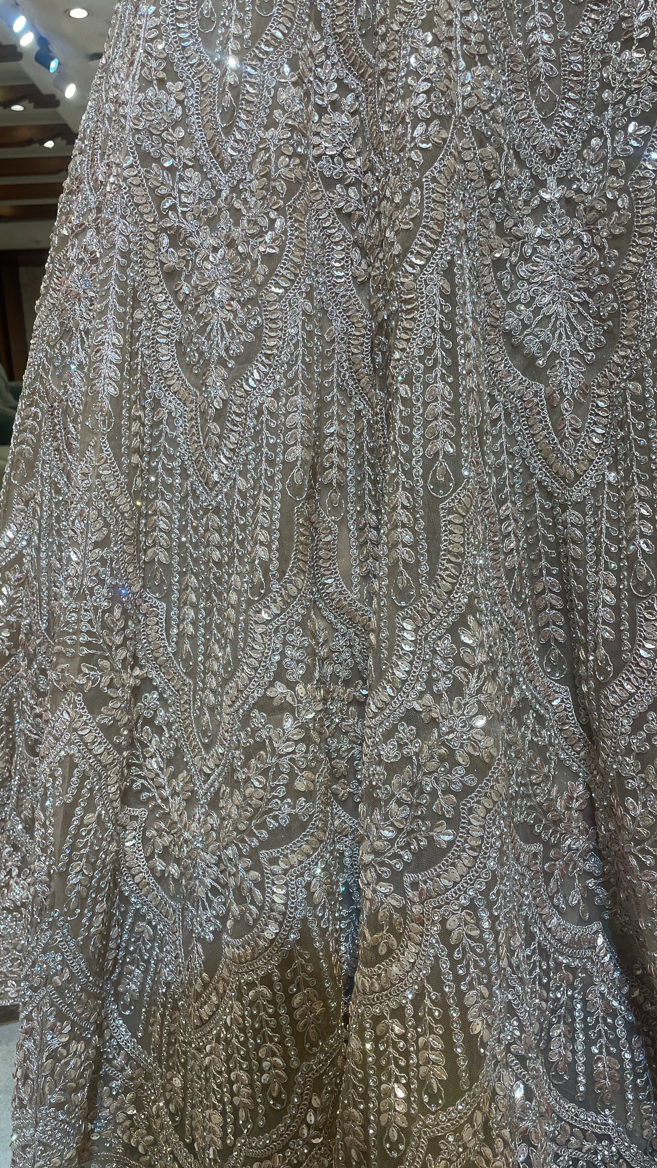 Peach net lehenga with mirrorwork & sequins