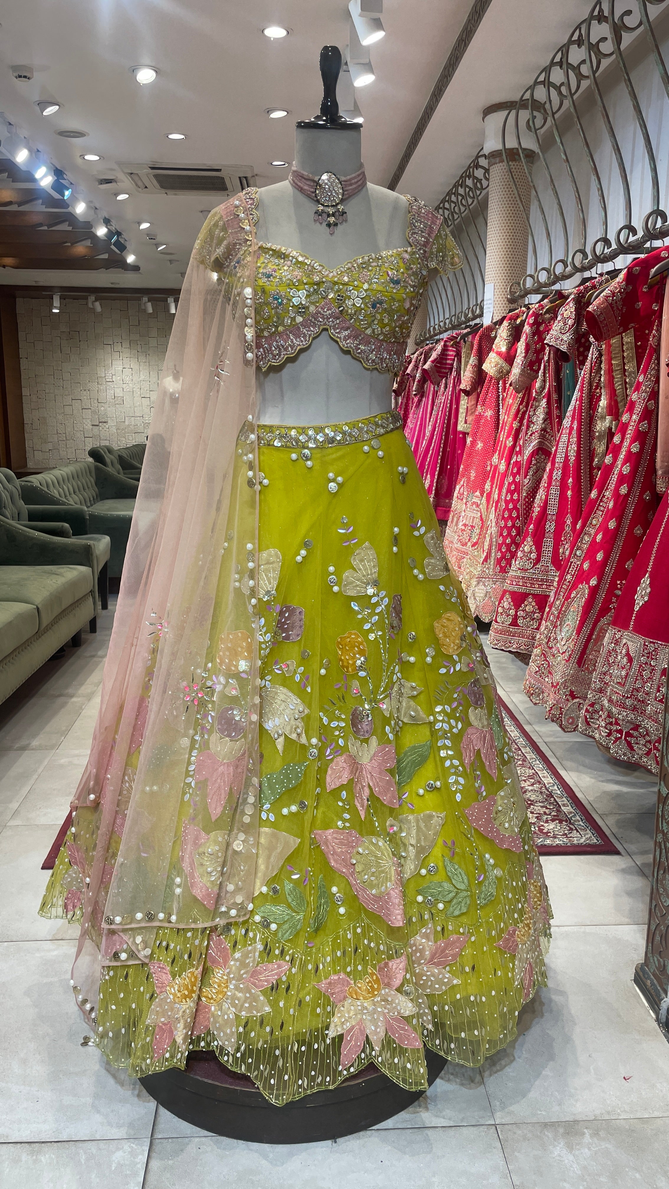 Green net lehenga with pearl embellishments & contrasting dupatta