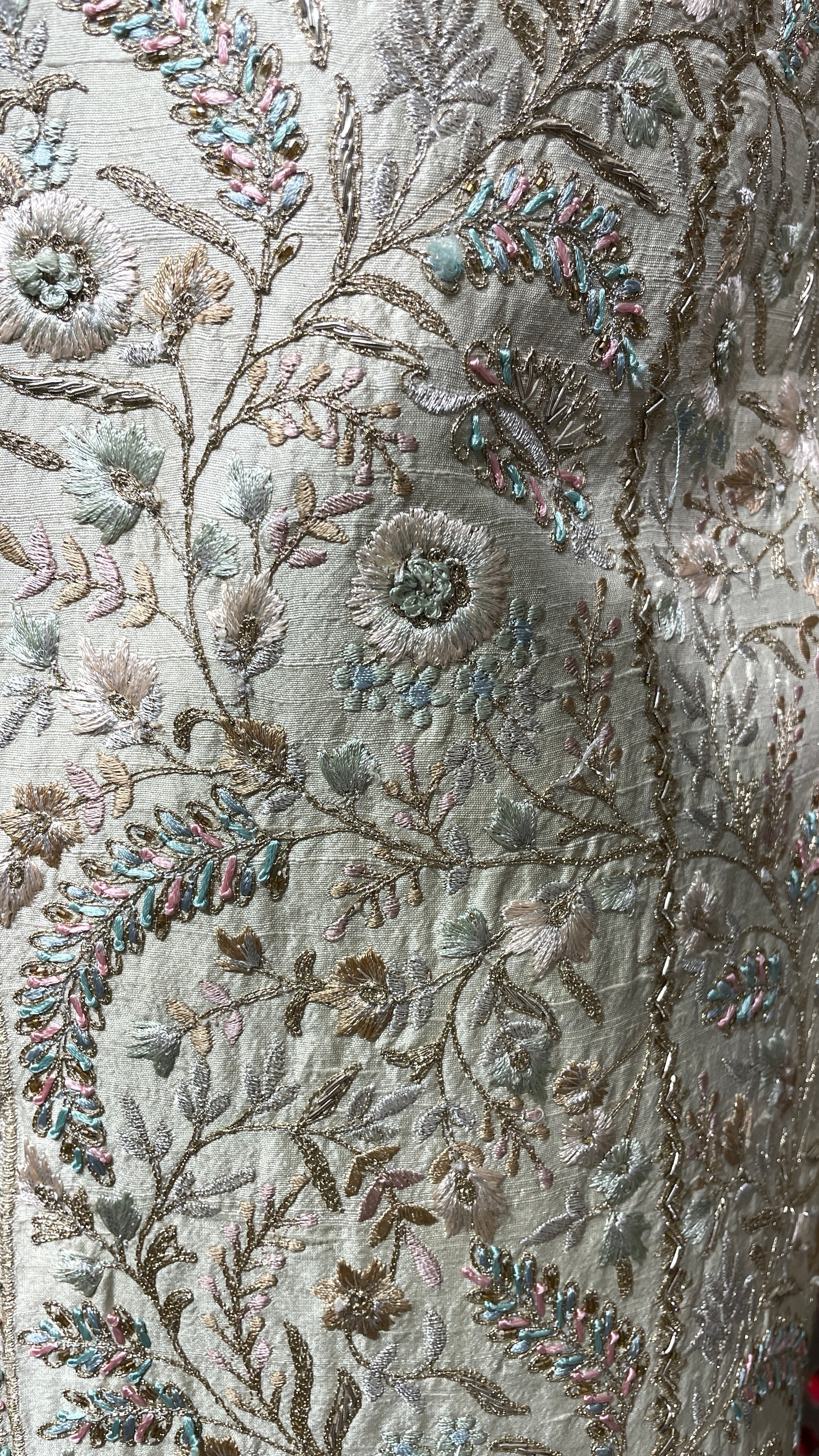 Cream men’s silk sherwani with floral motifs