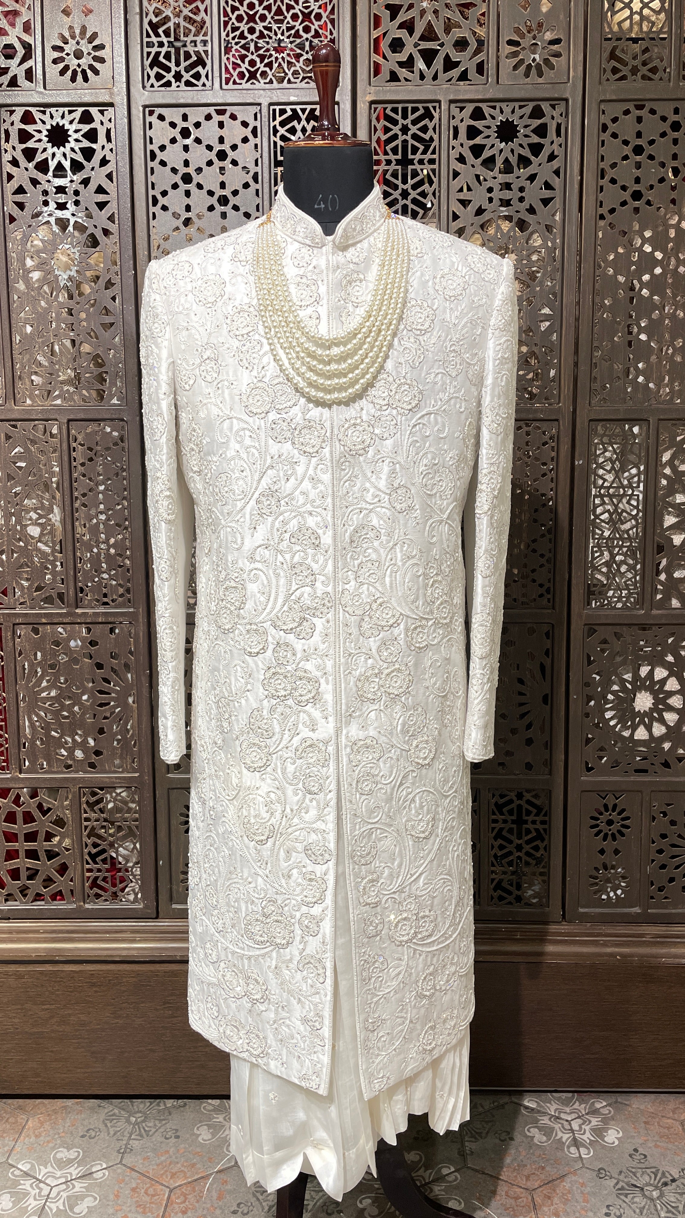 Ivory silk men’s sherwani with pearl and cutdana embellishments
