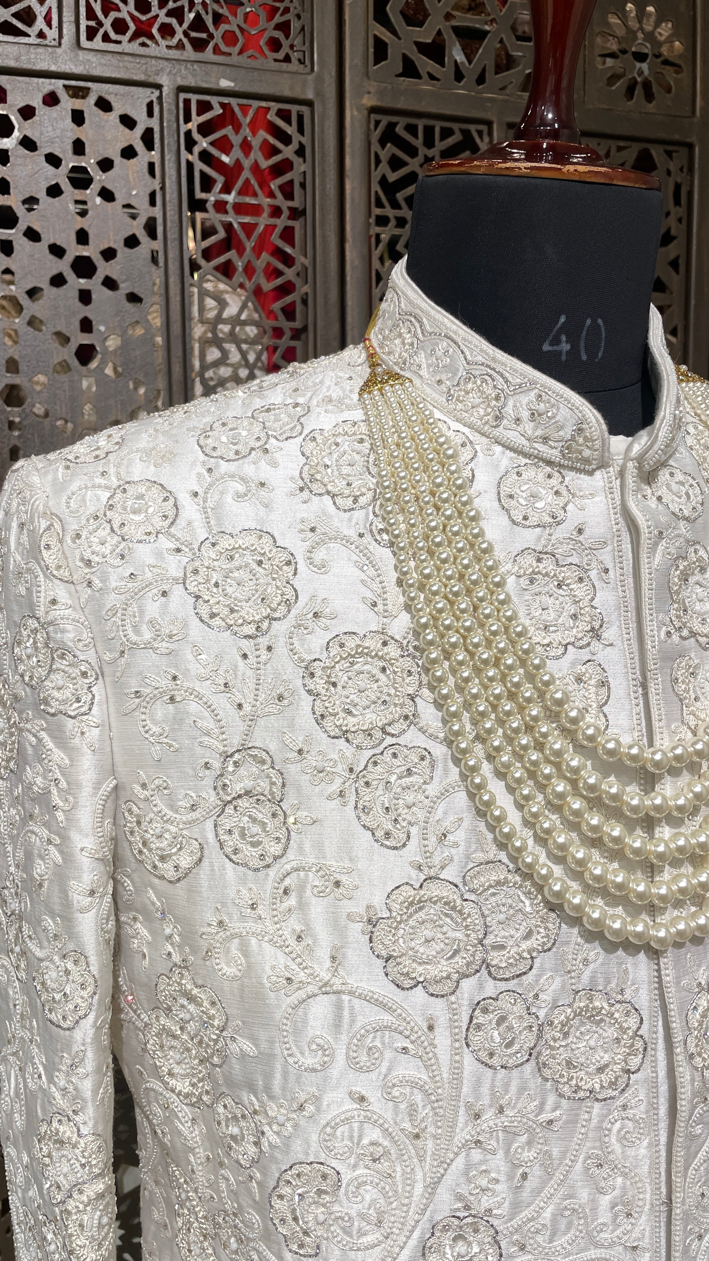 Ivory silk men’s sherwani with pearl and cutdana embellishments