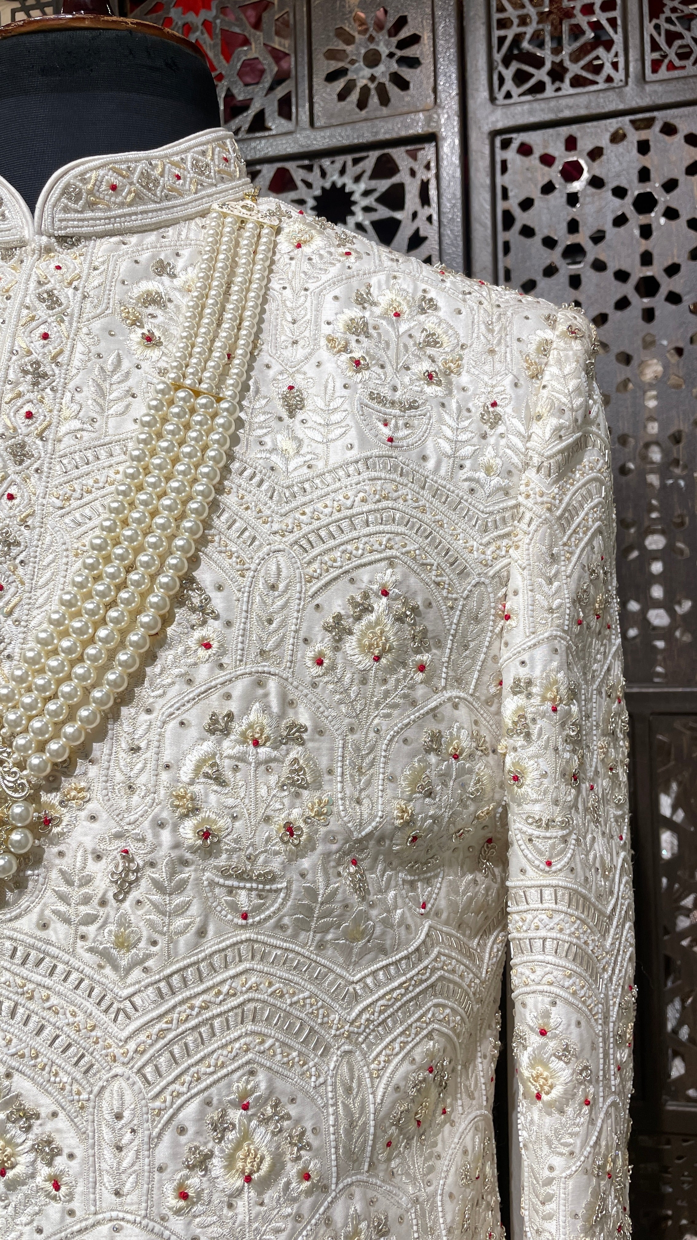 Cream sherwani with Anarkali kurta and zariwork