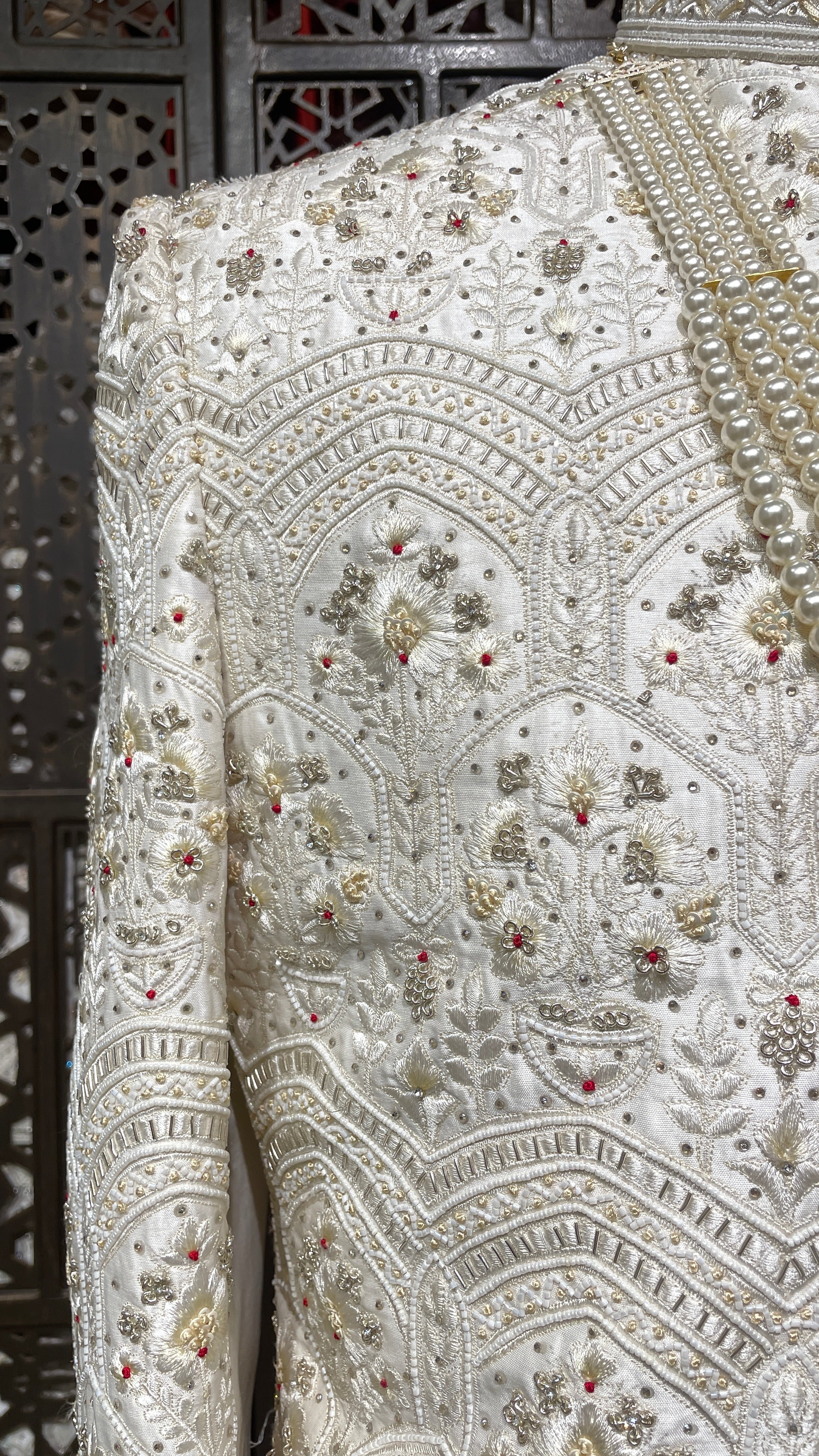 Cream sherwani with Anarkali kurta and zariwork