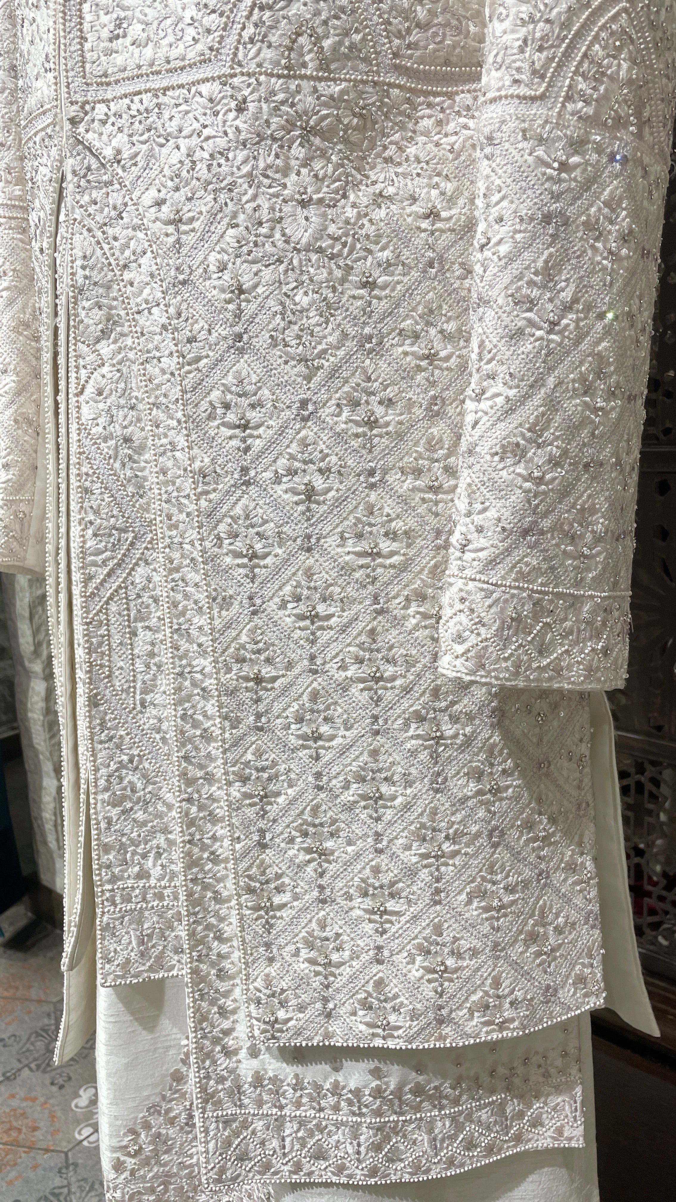 Ivory layered sherwani with threadwork and embellishment