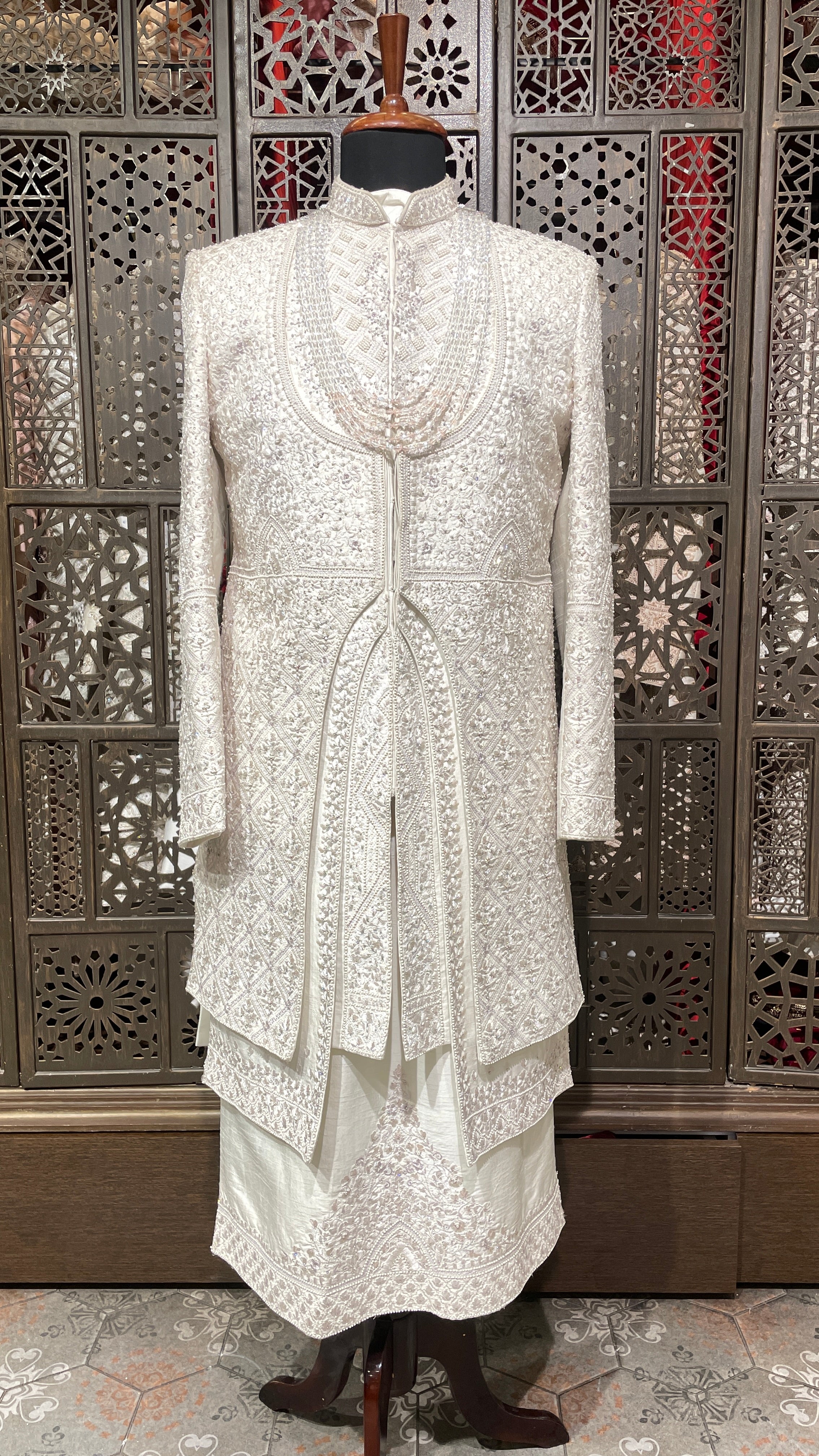 Ivory layered sherwani with threadwork and embellishment