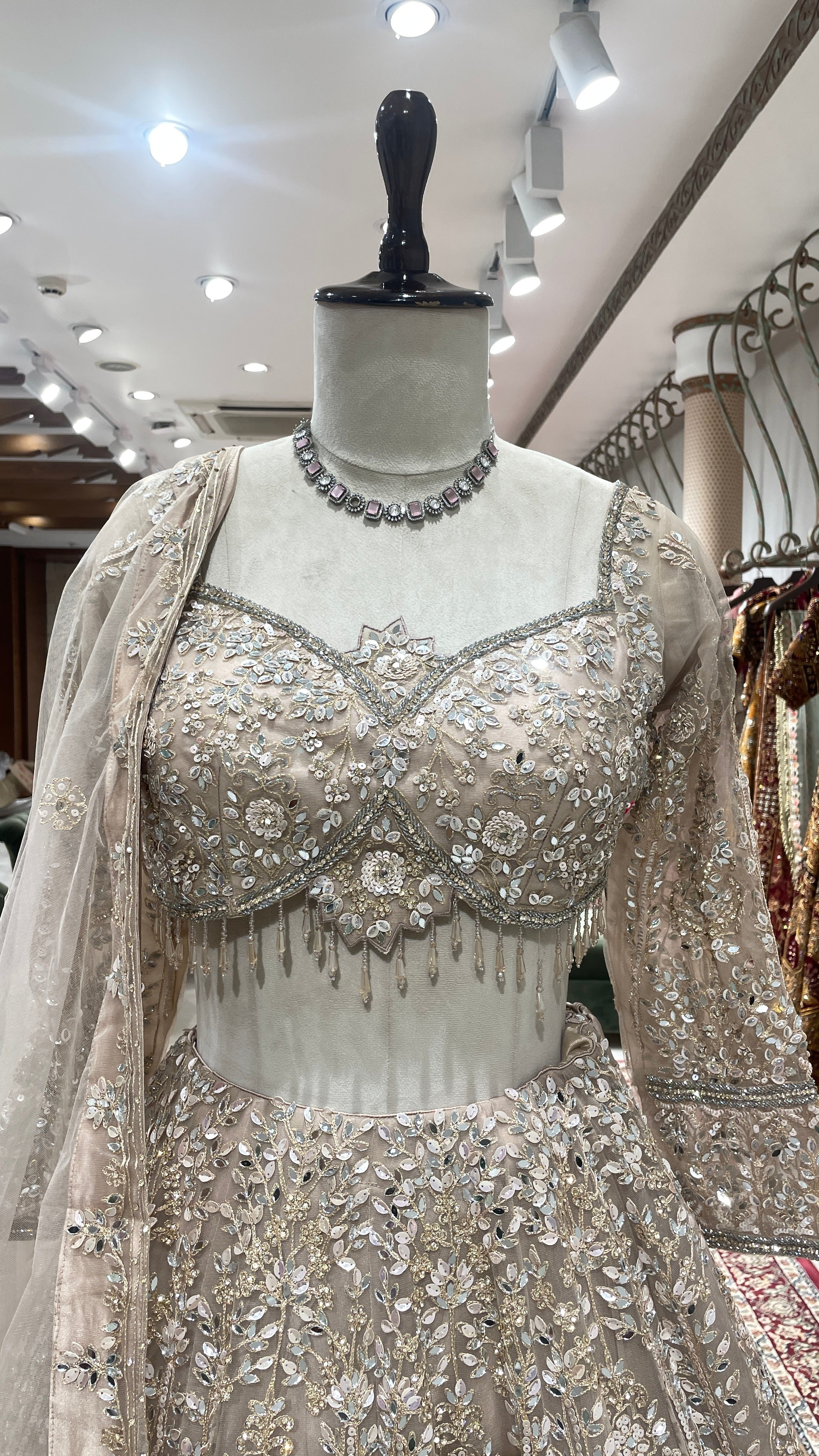 Gold net lehenga with mirror work