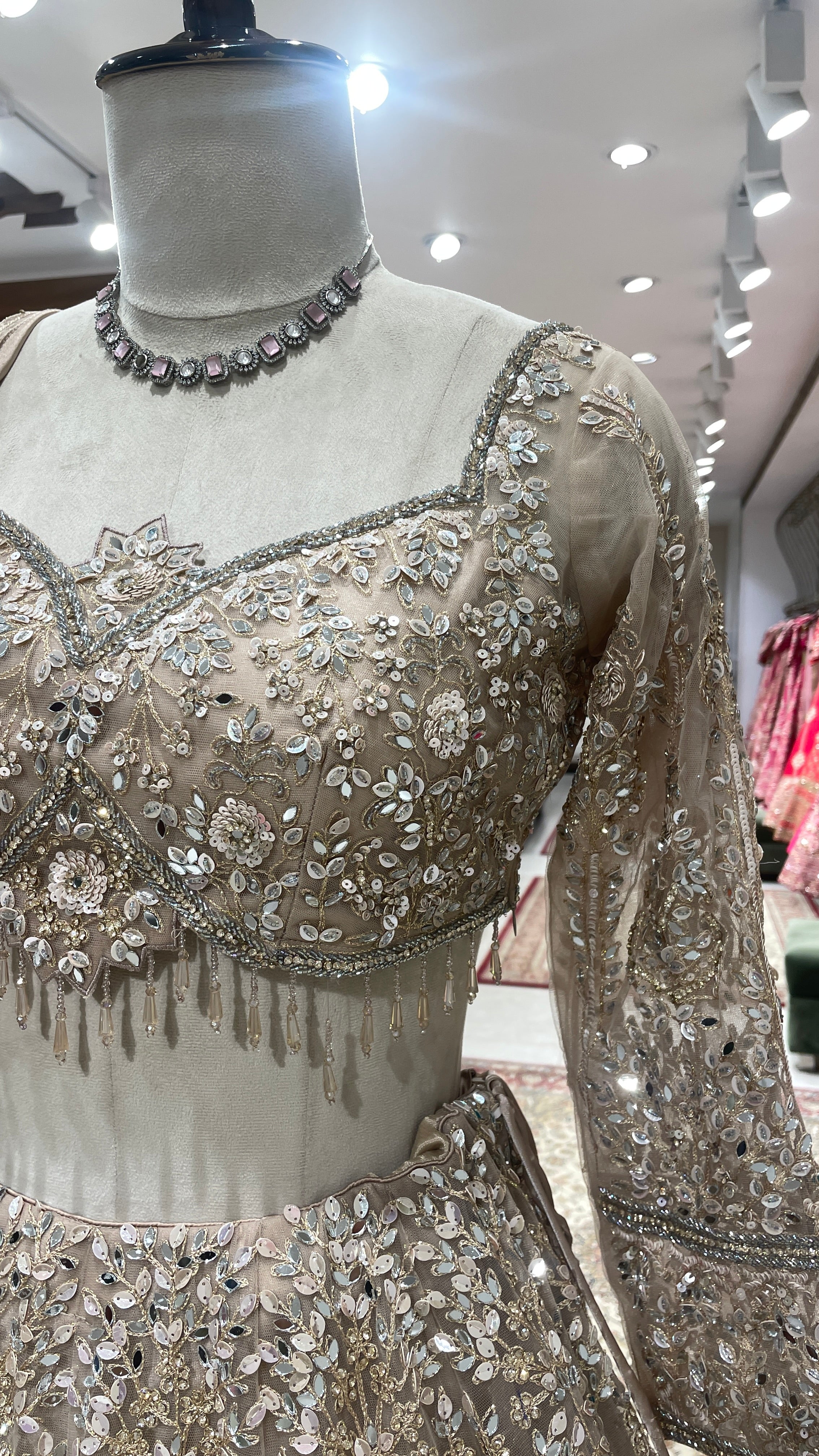 Gold net lehenga with mirror work