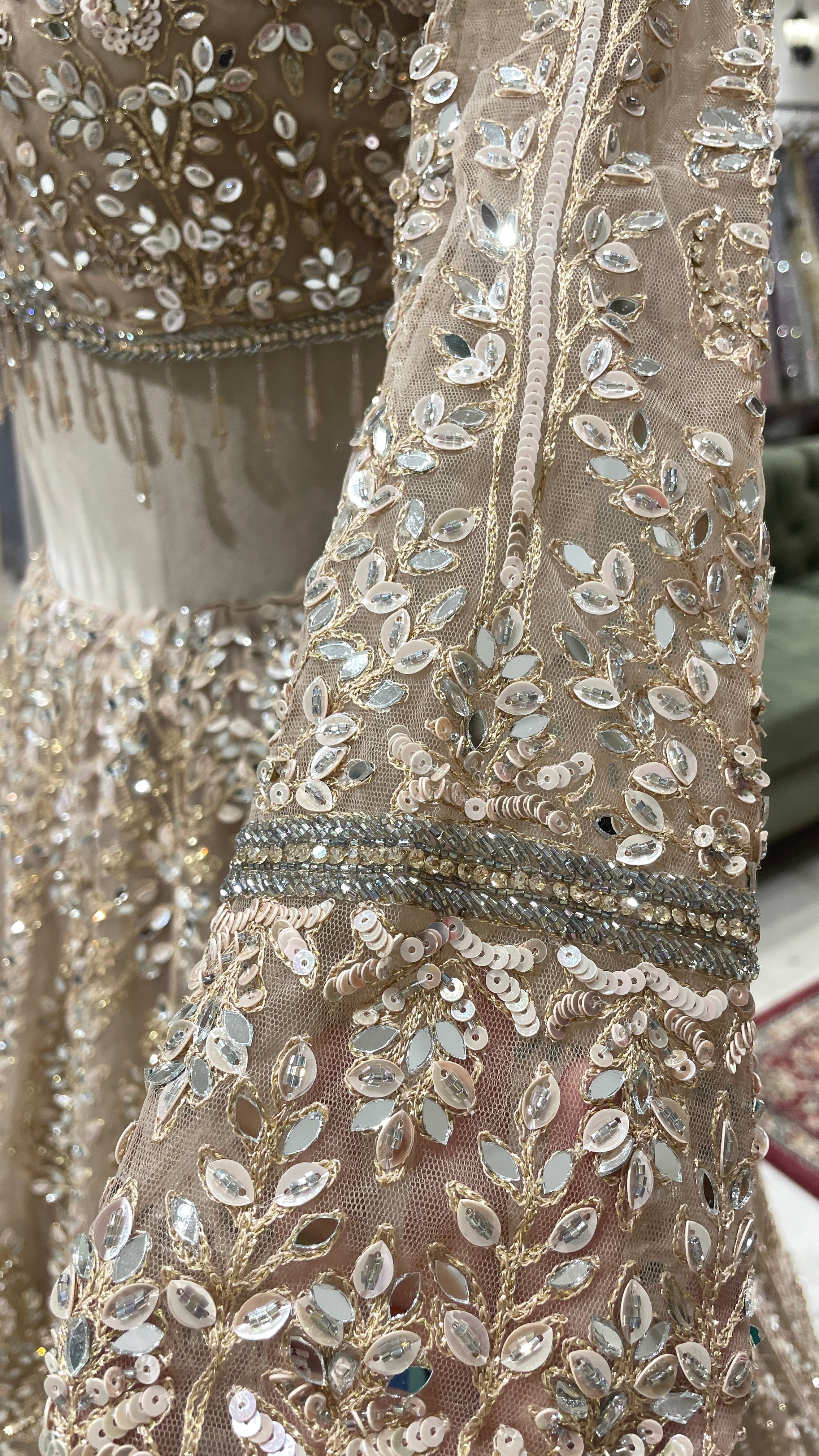 Gold net lehenga with mirror work