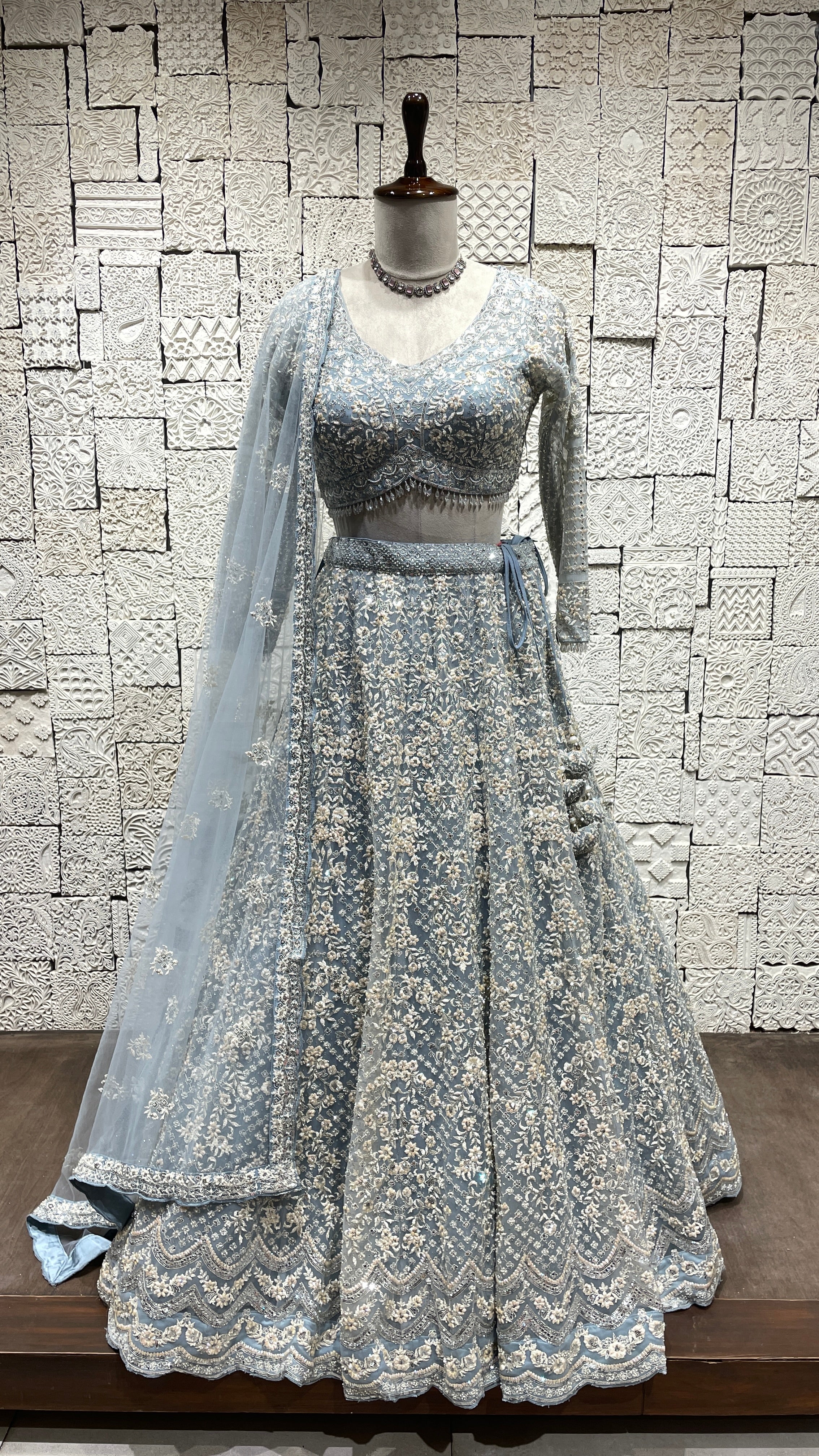 Pastel blue net lehenga with pearl and sequins embellishments