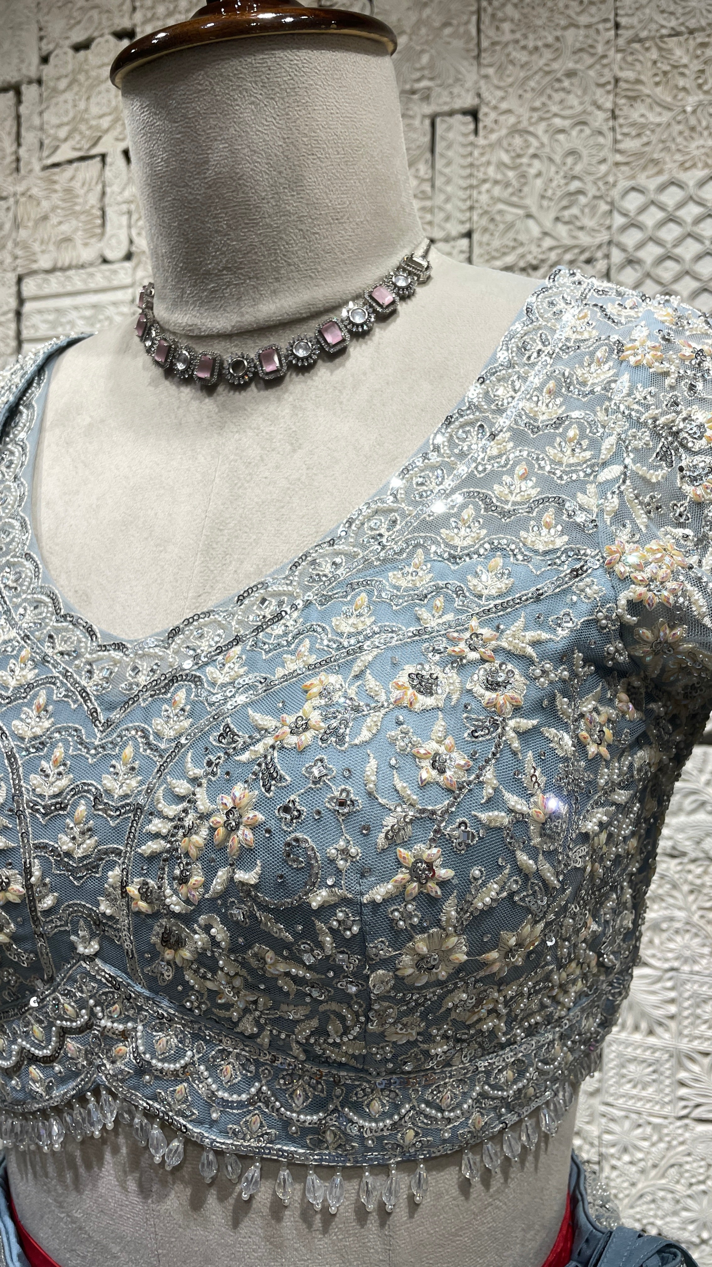 Pastel blue net lehenga with pearl and sequins embellishments