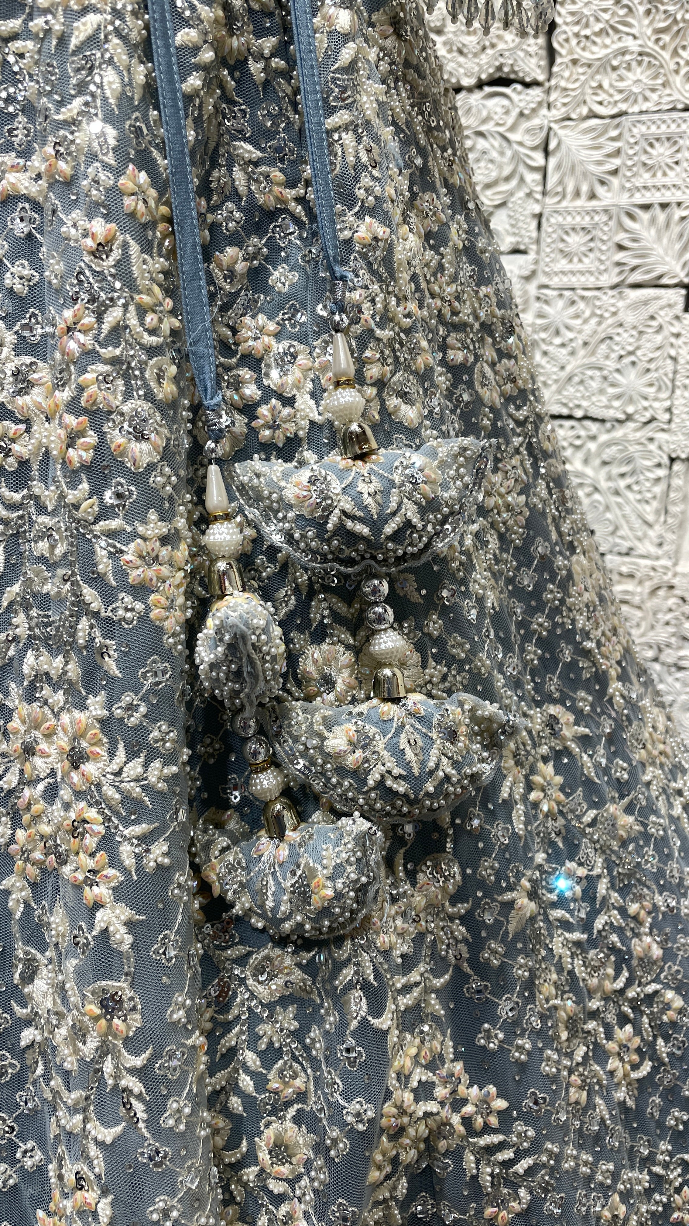 Pastel blue net lehenga with pearl and sequins embellishments