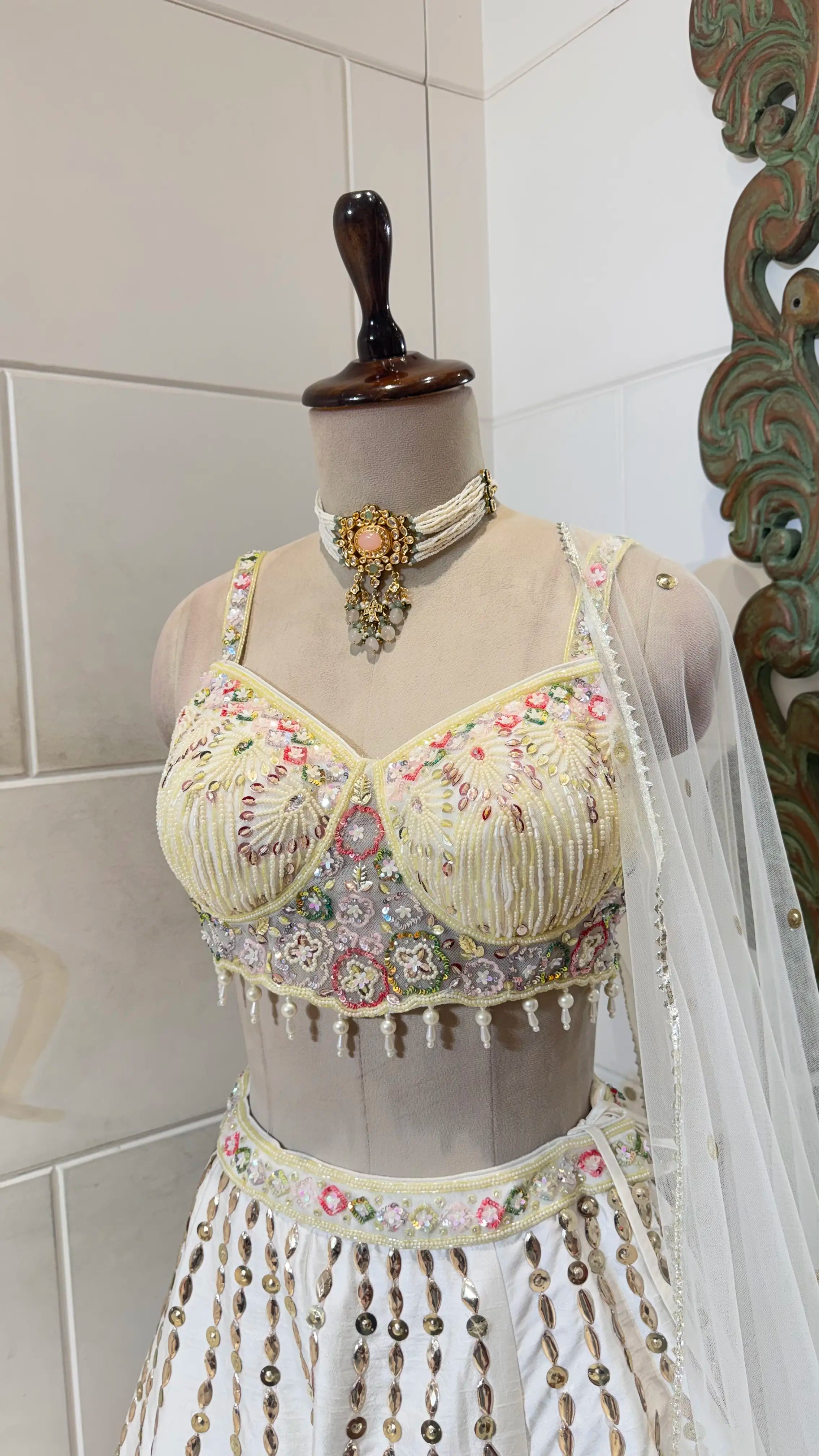 White lehenga with floral embroidery