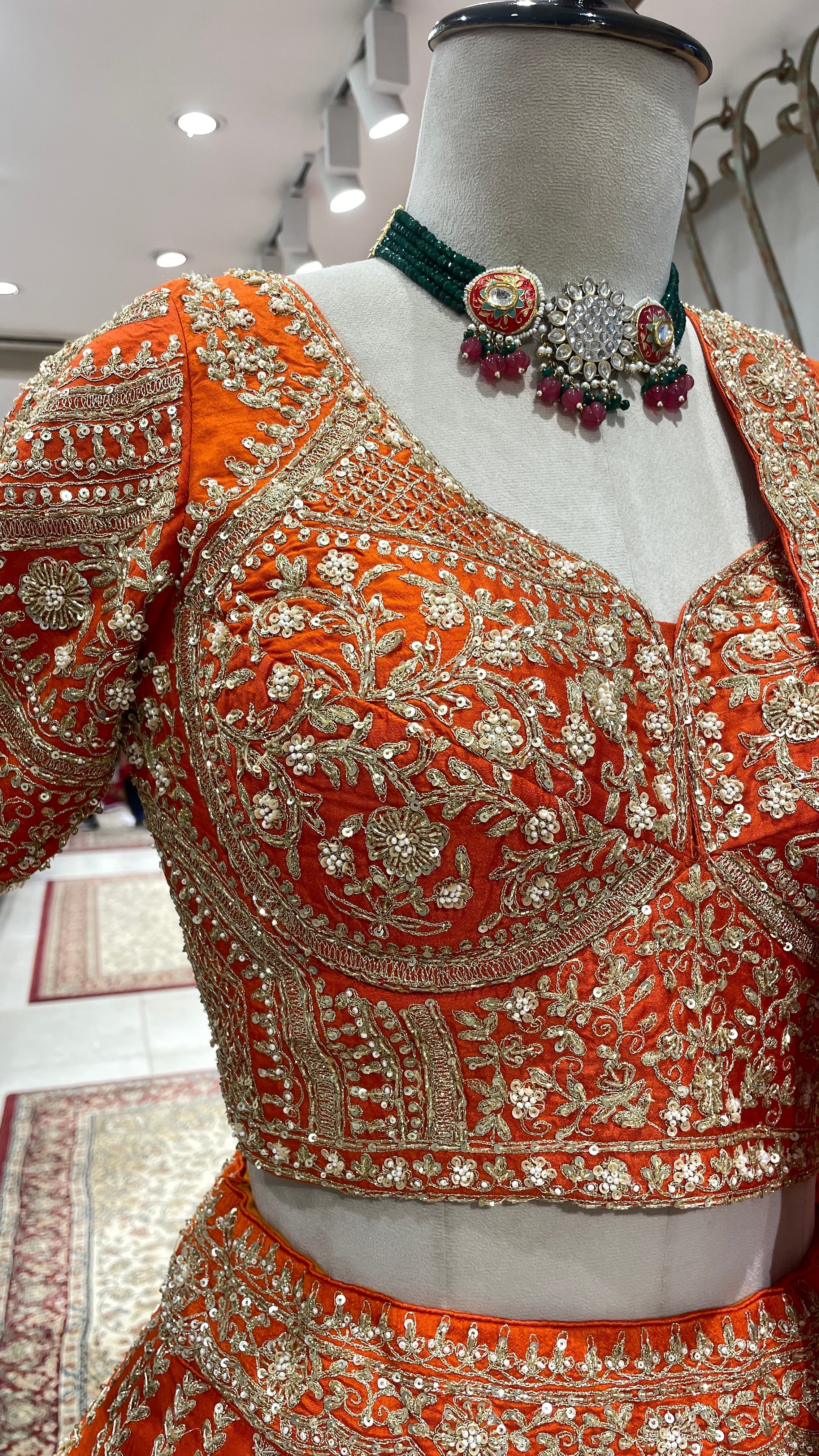 Orange bridal silk lehenga with zariwork