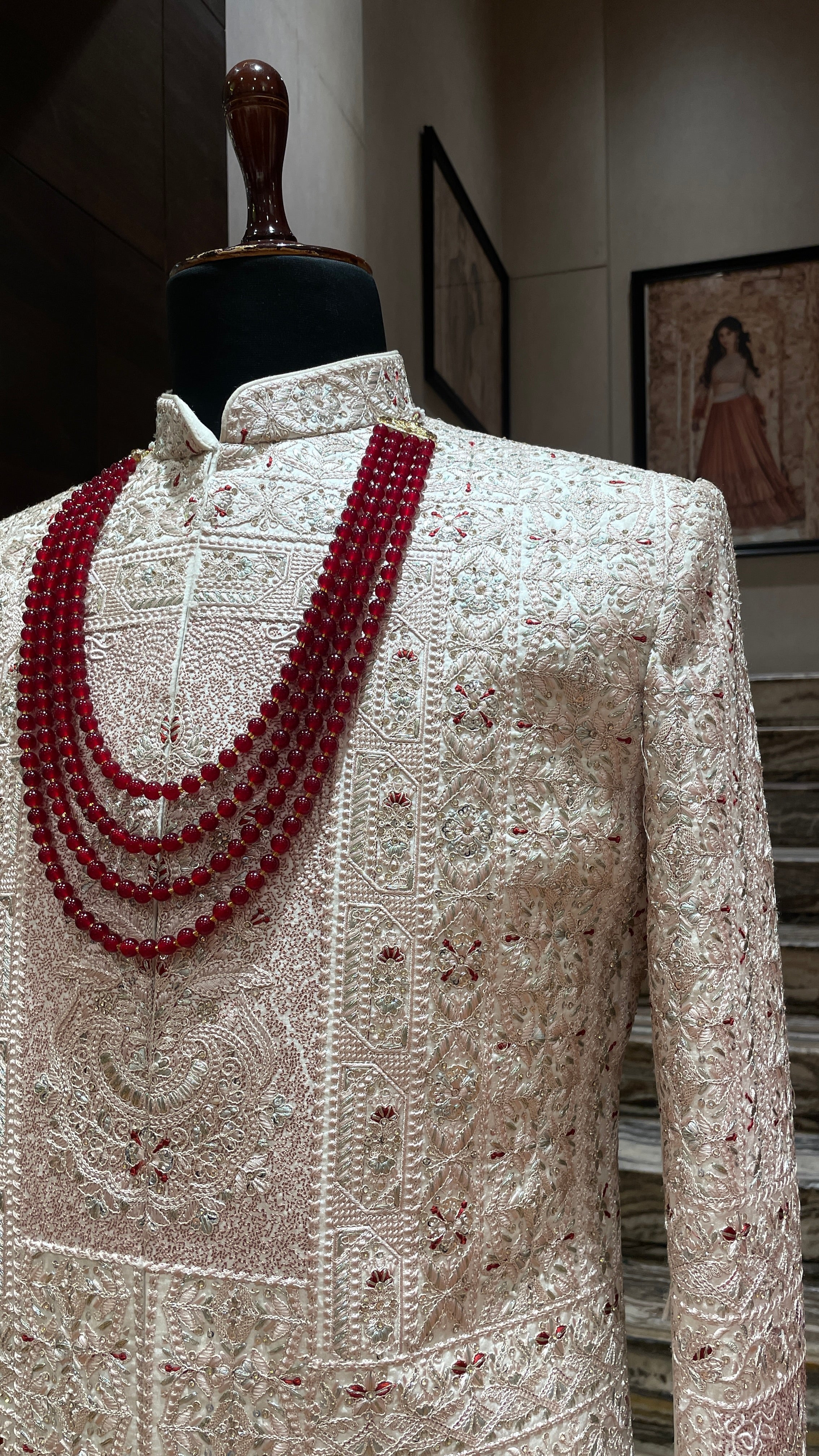Pastel pink Sherwani with red motifs