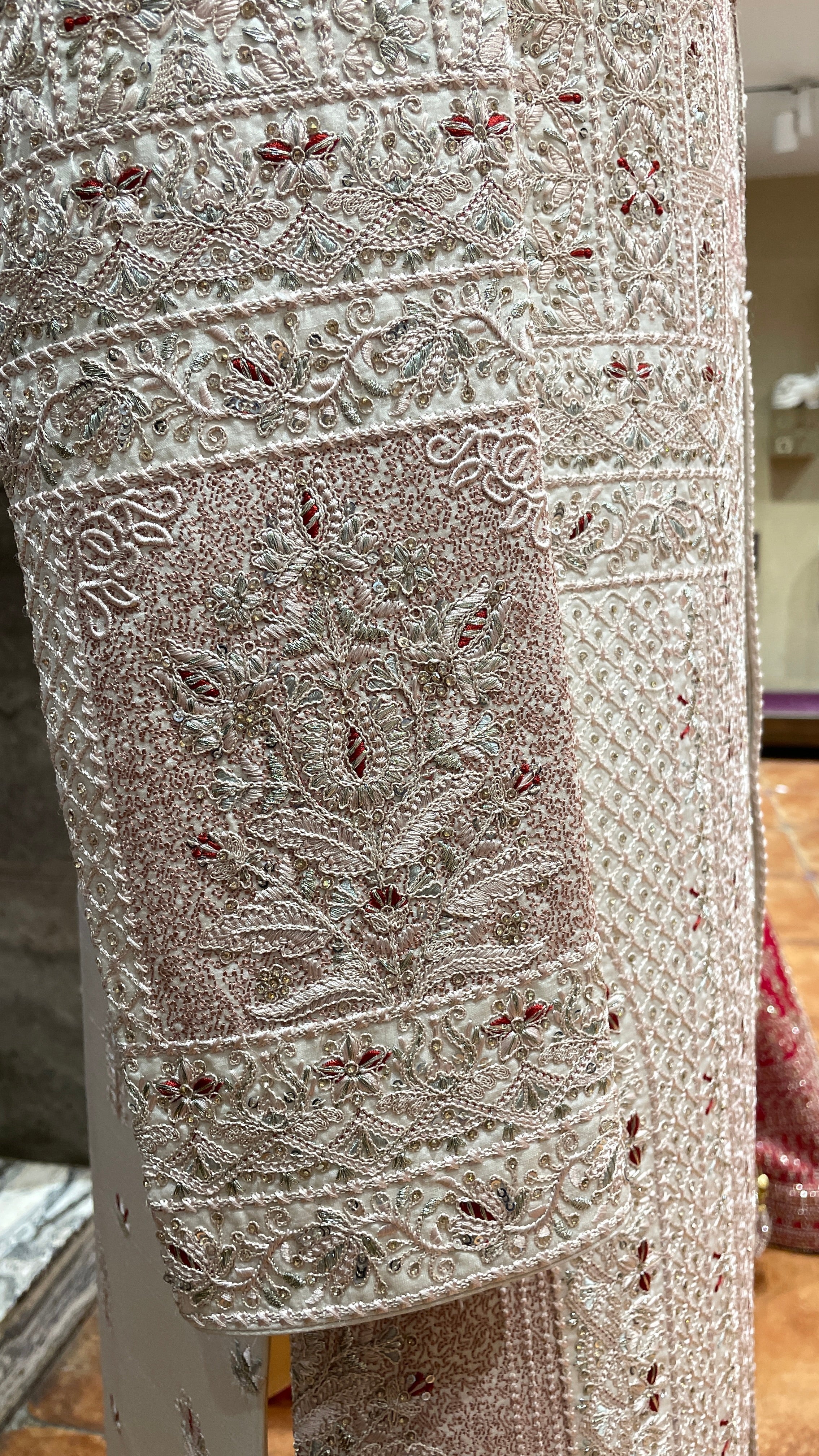 Pastel pink Sherwani with red motifs