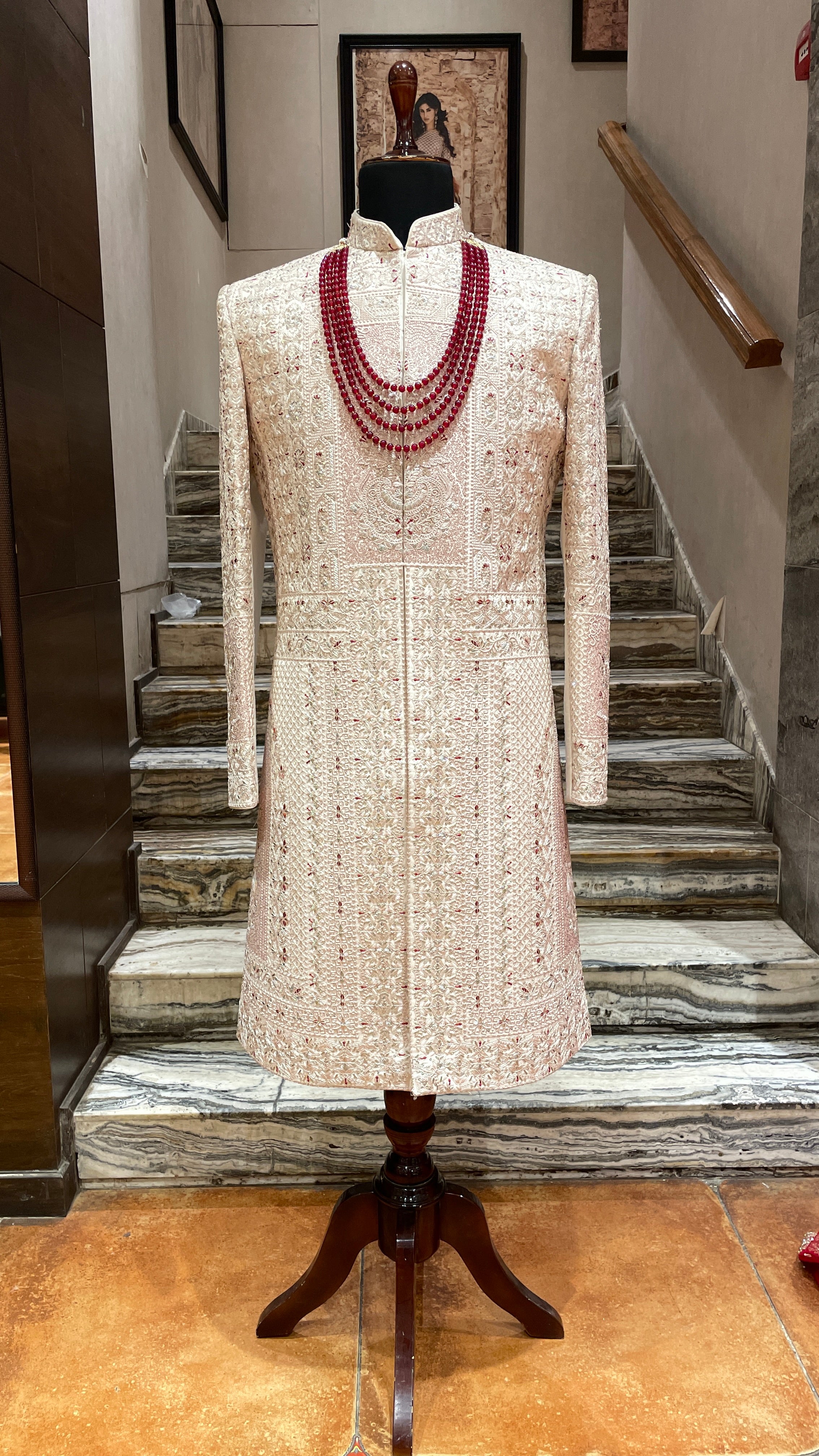 Pastel pink Sherwani with red motifs