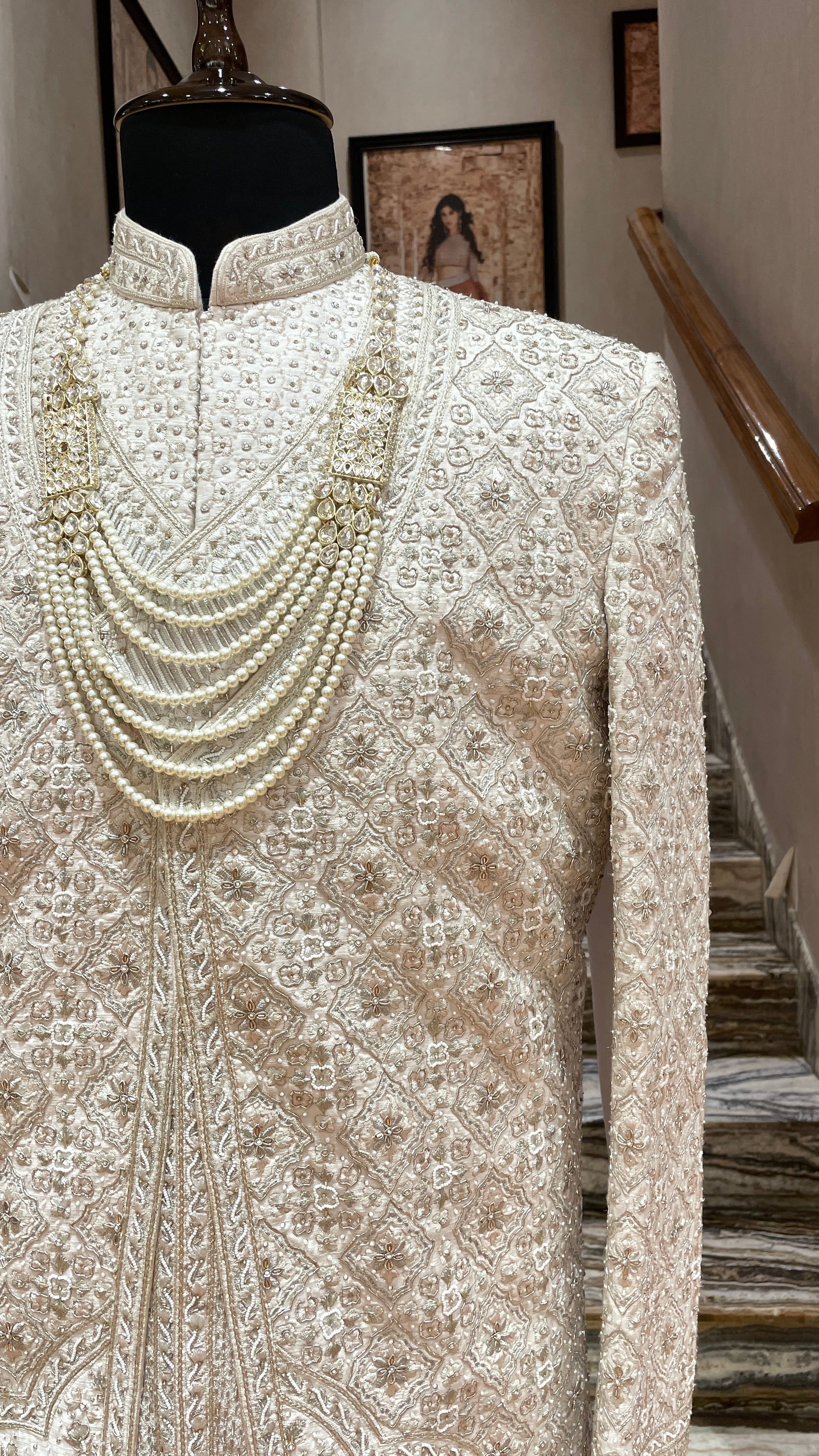 Cream silk Sherwani with gold & silver embellishments