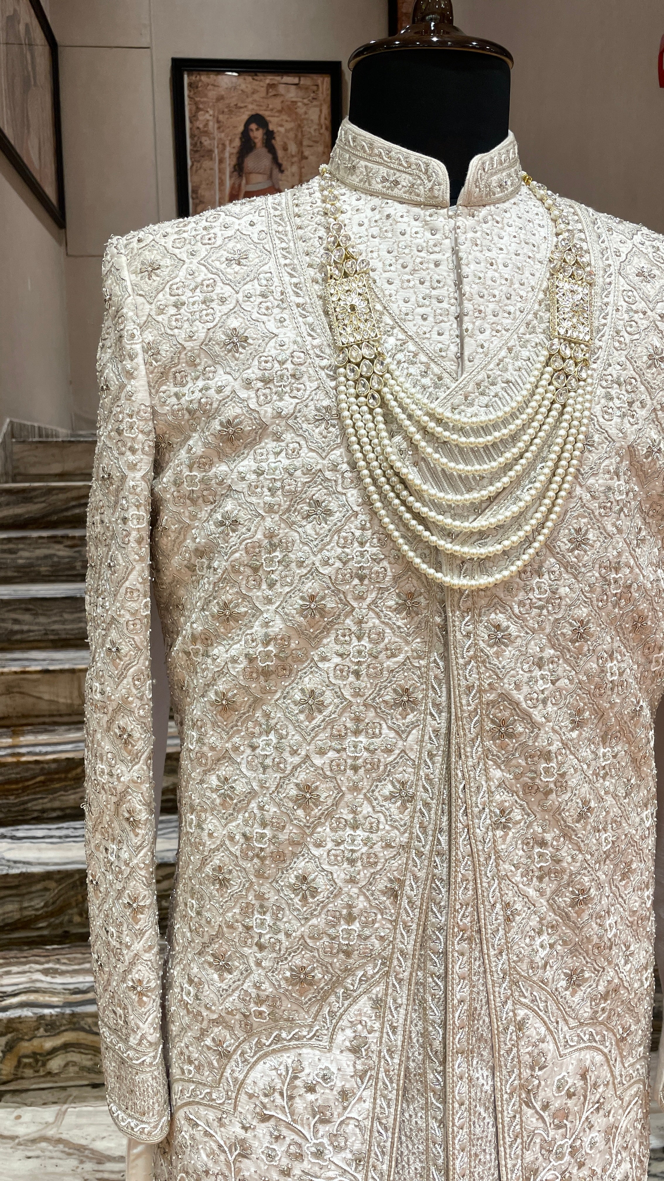 Cream silk Sherwani with gold & silver embellishments