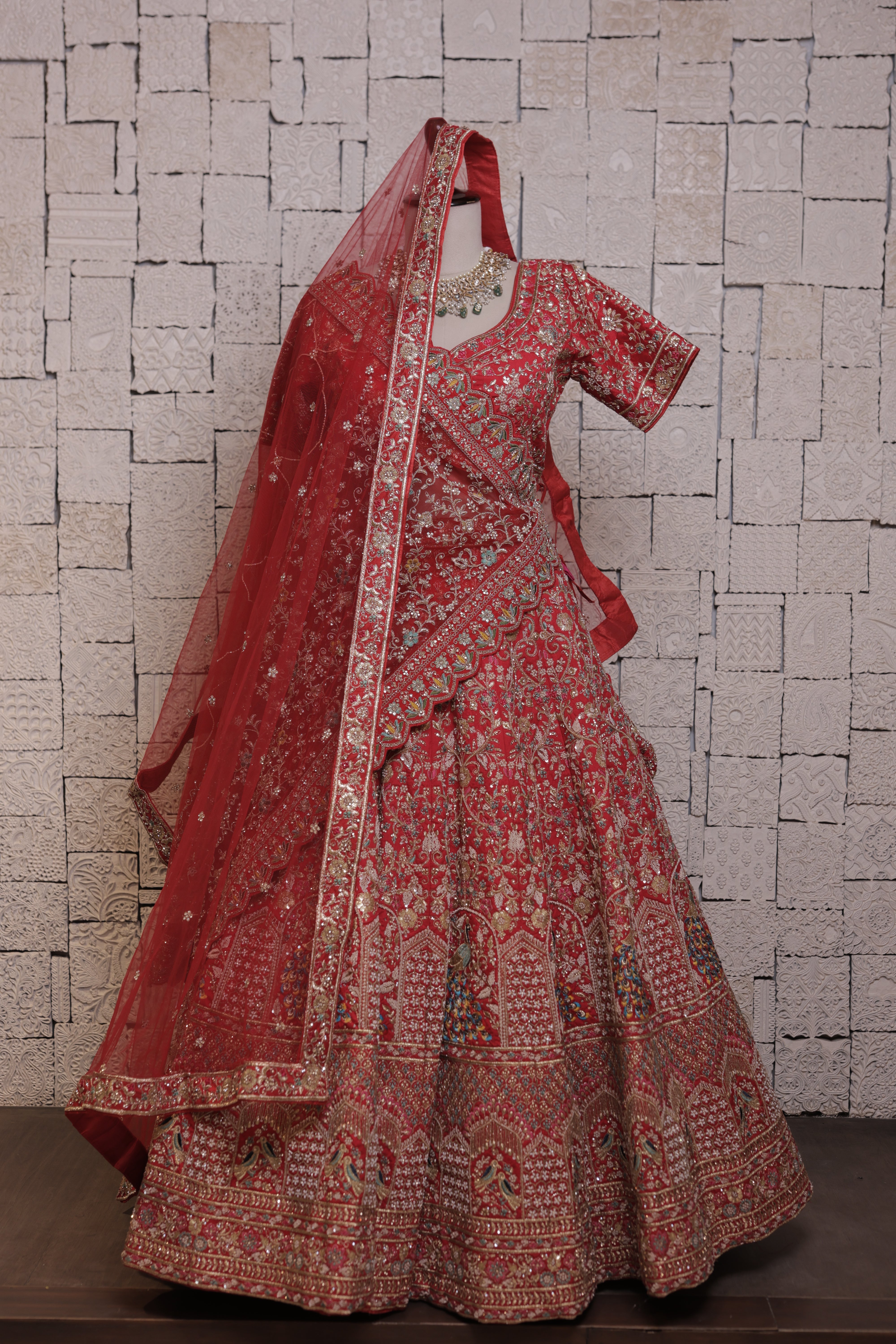 Red bridal lehenga with peacock embroidery design
