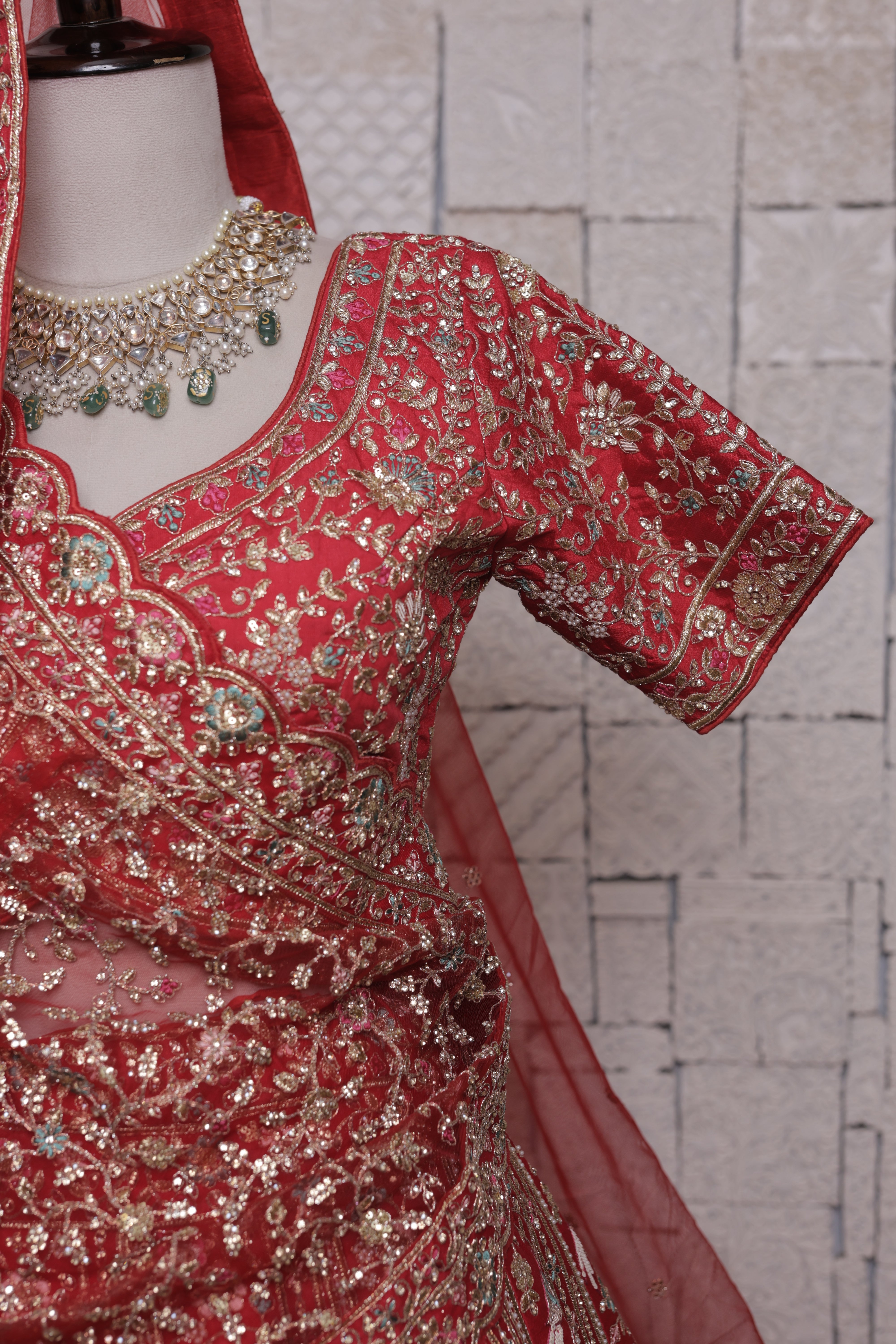 Red bridal lehenga with Doli mor embroidery design